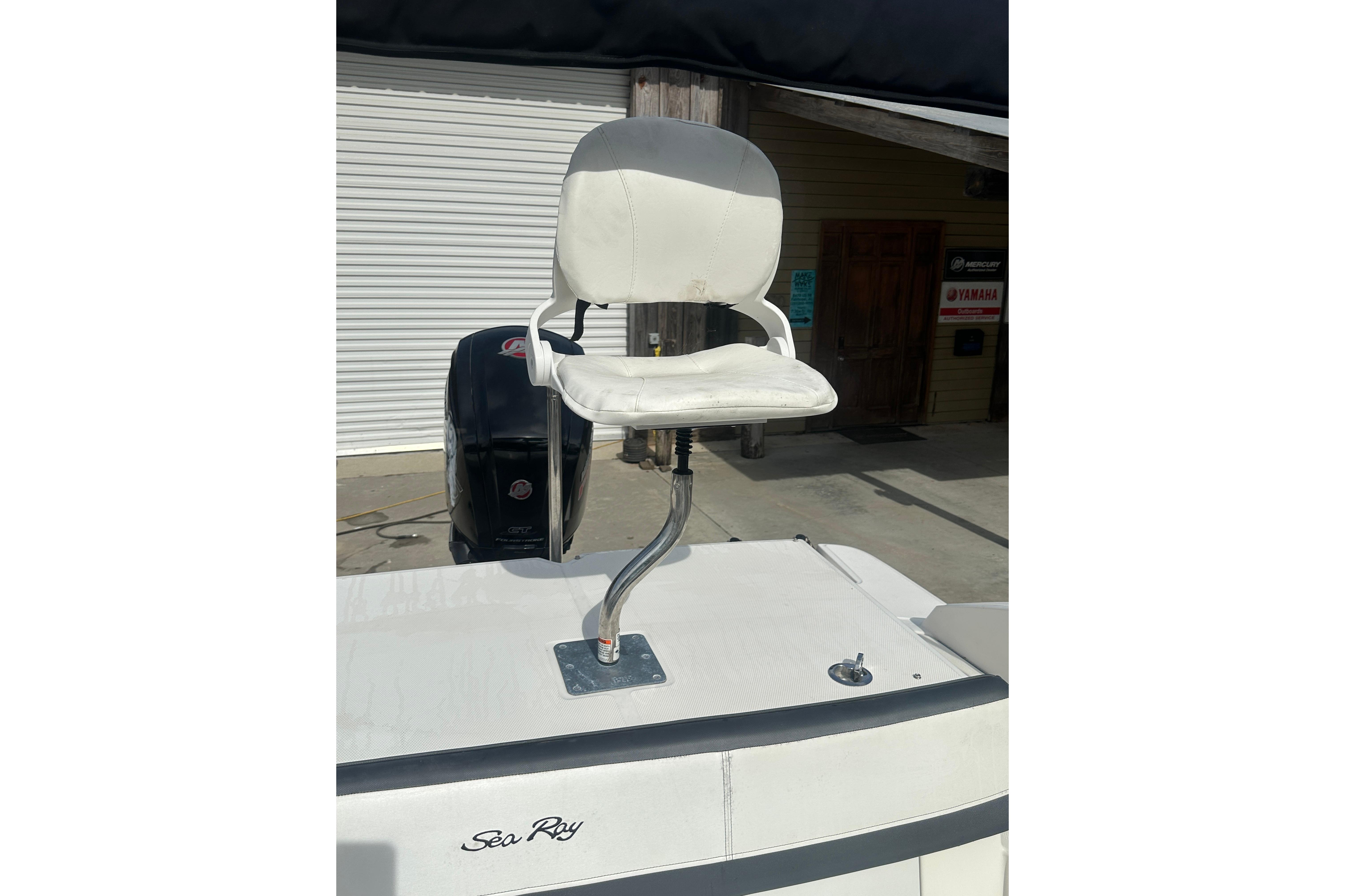 2017 Sea Ray SPX 190 Outboard boat with white captain's chair and visible engine.