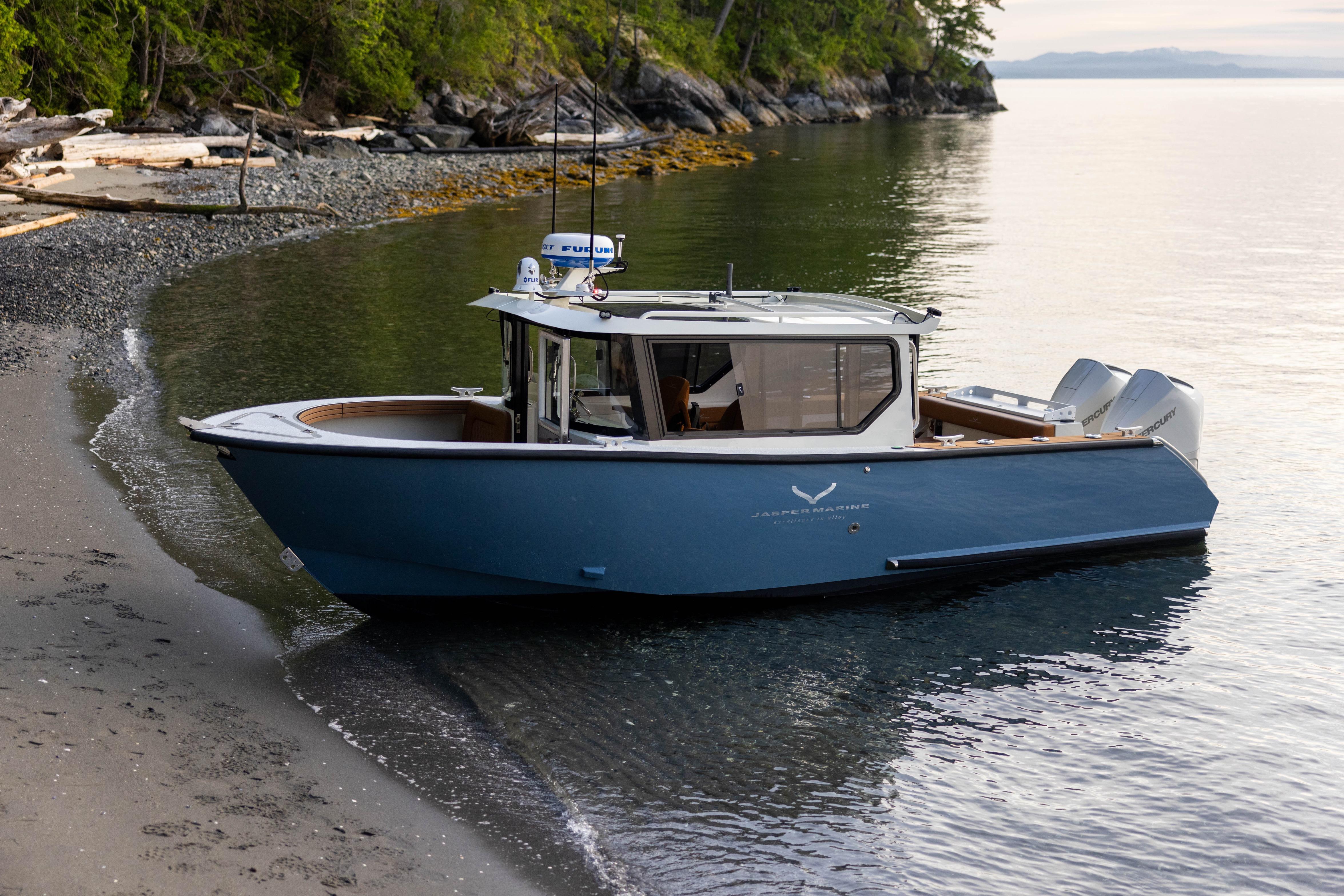 2026 Jasper Marine Defender 22 boat docked on a serene, forested shoreline.