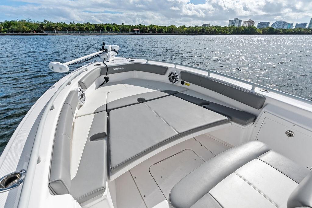 2023 Everglades 243 Center Console boat with spacious seating on calm water.