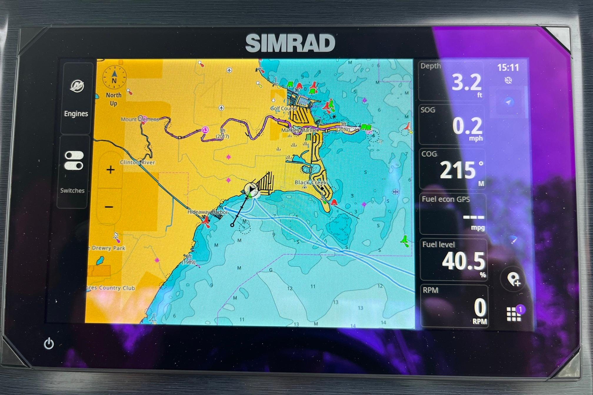 Simrad navigation display on 2024 Harris Grand Mariner 250 boat, showing map and data.