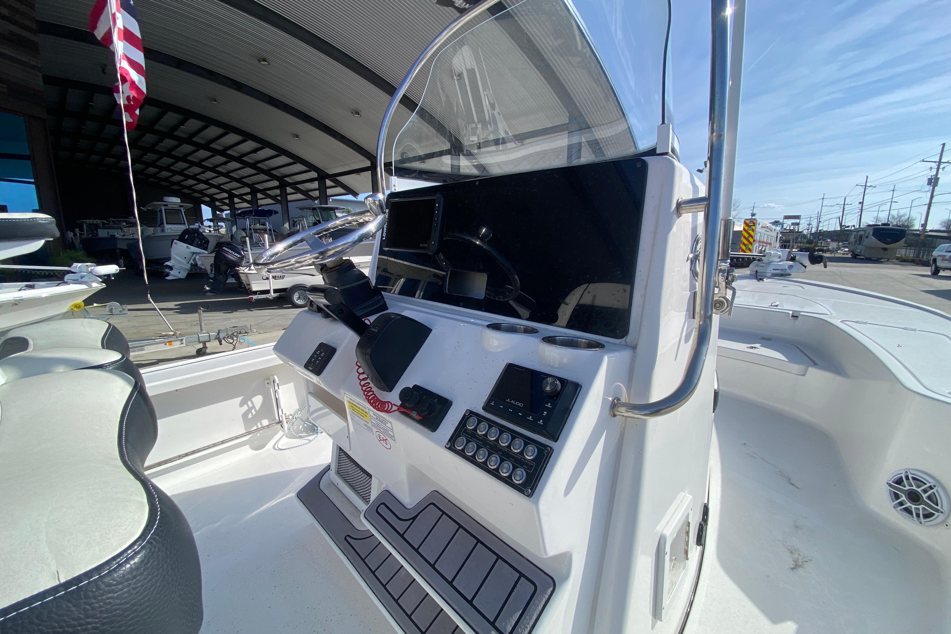 2023 Tidewater 2410 Bay Max boat console with steering wheel and controls.