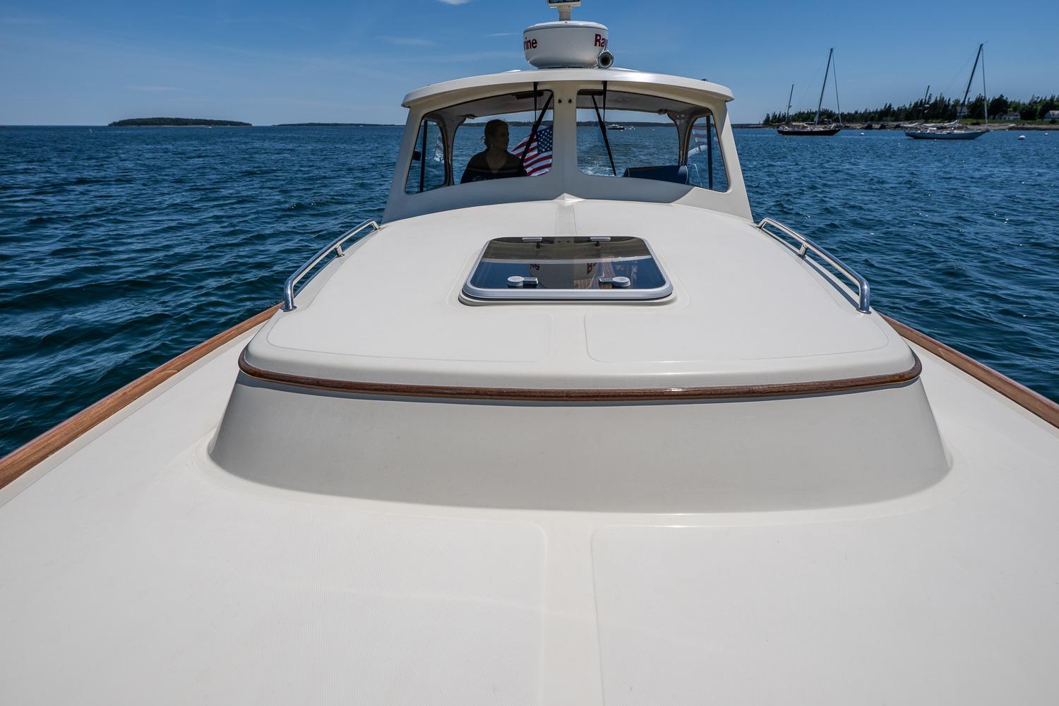 2001 Hinckley Picnic Boat 36 Classic cruising on open water with clear skies.