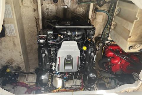 Engine compartment of a 2012 Bayliner 285 Cruiser, showcasing detailed mechanical components.