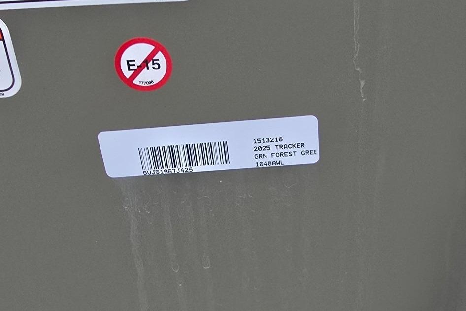 Label on 2025 Tracker Grizzly 1648 Jon boat, green color, with barcode and E15 warning.
