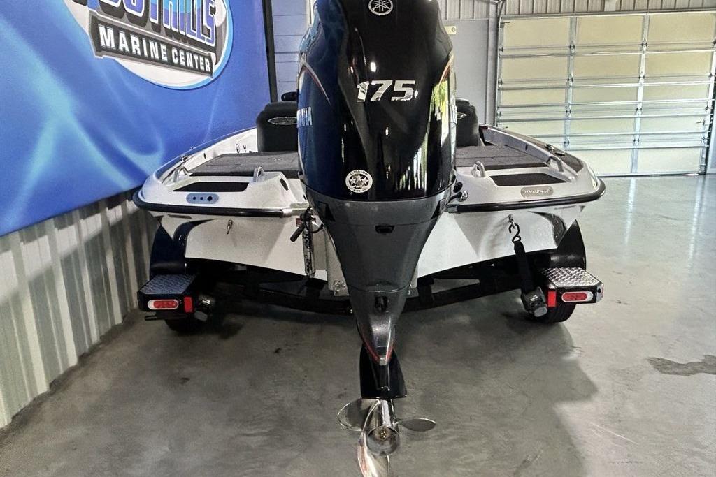 2026 Phoenix 818 Pro boat with Yamaha 175 engine in a marine center.
