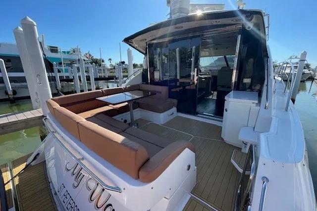 2016 Sea Ray Sundancer 510 yacht with spacious deck and seating at marina.