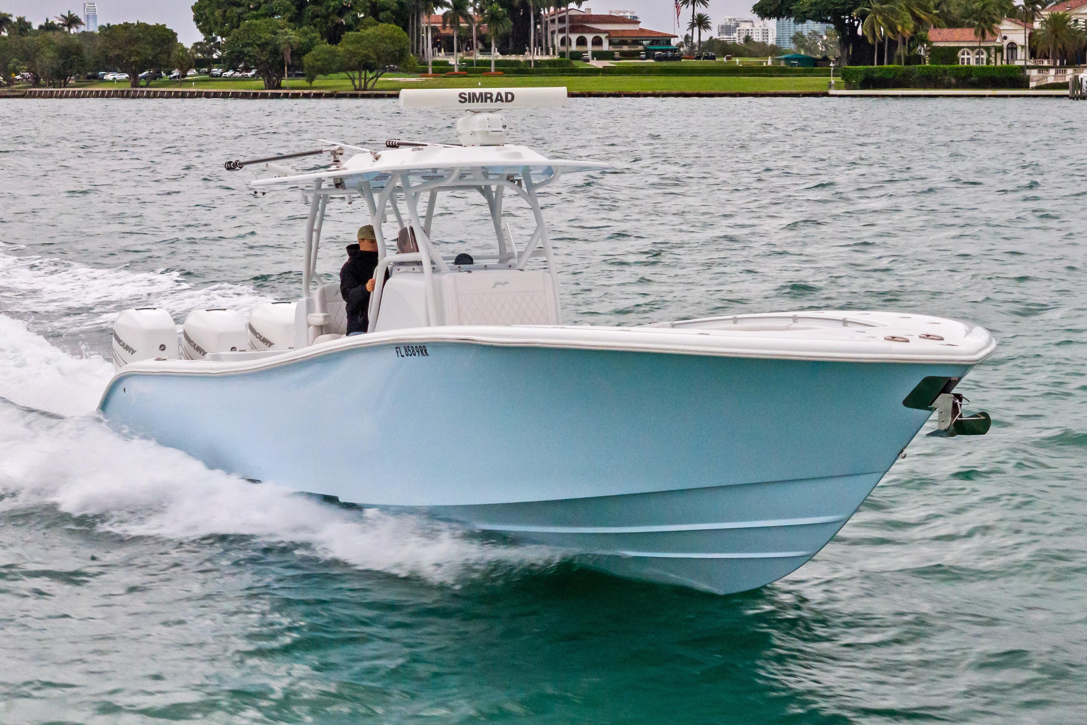 2021 Yellowfin 36 Offshore boat cruising on water, featuring sleek design and powerful engines.