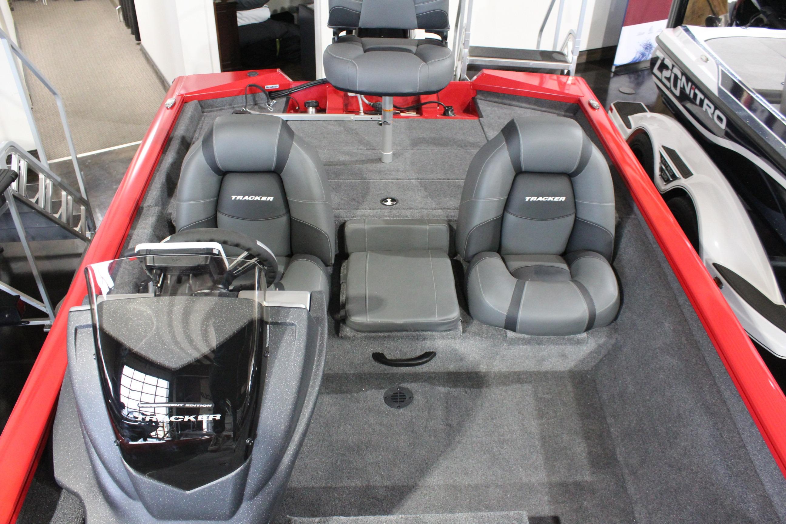 2026 Tracker Pro Team 175 boat interior with gray seating and steering console.