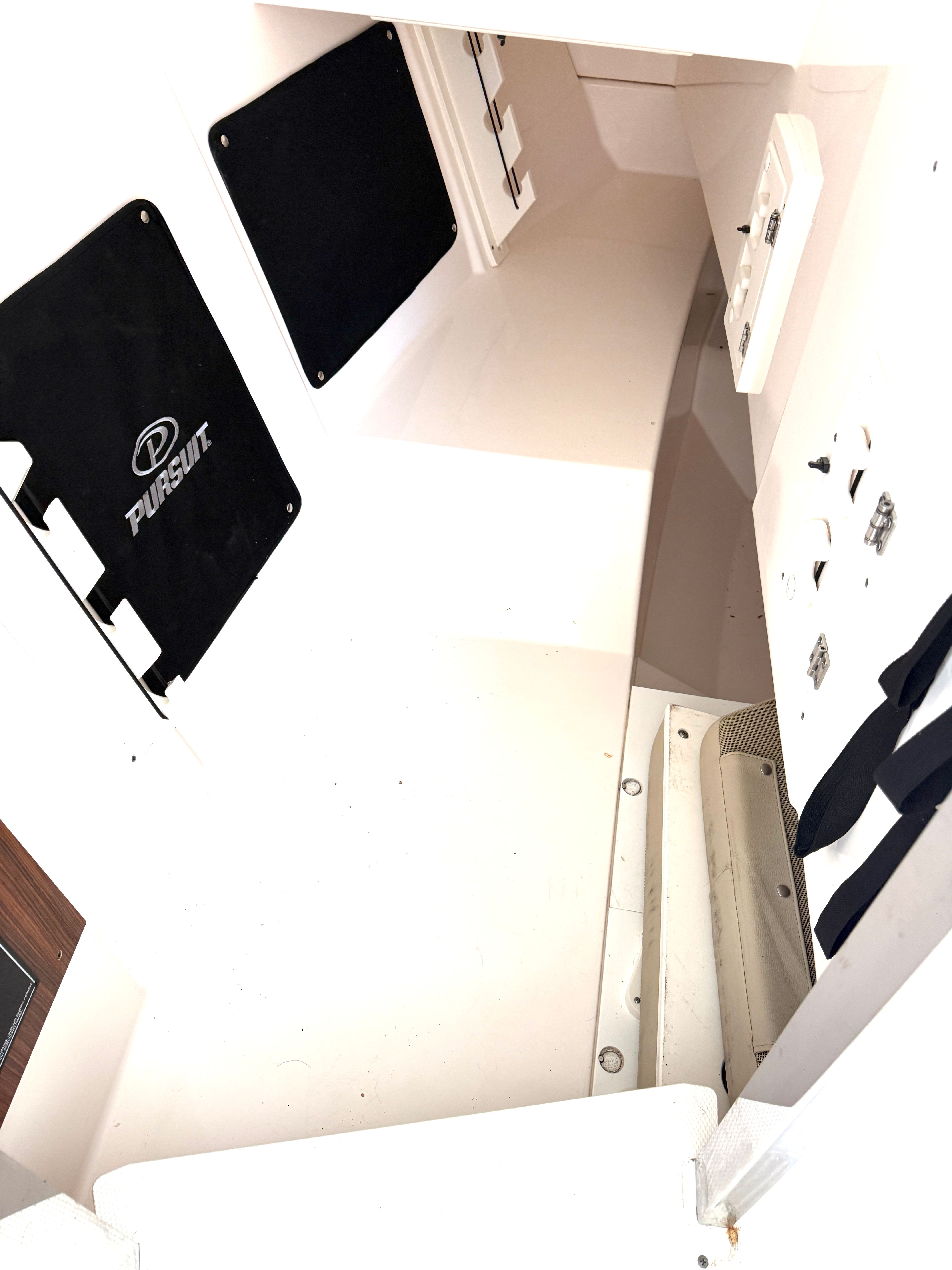 Interior of a 2017 Pursuit DC 295 Dual Console with white walls and black accents.