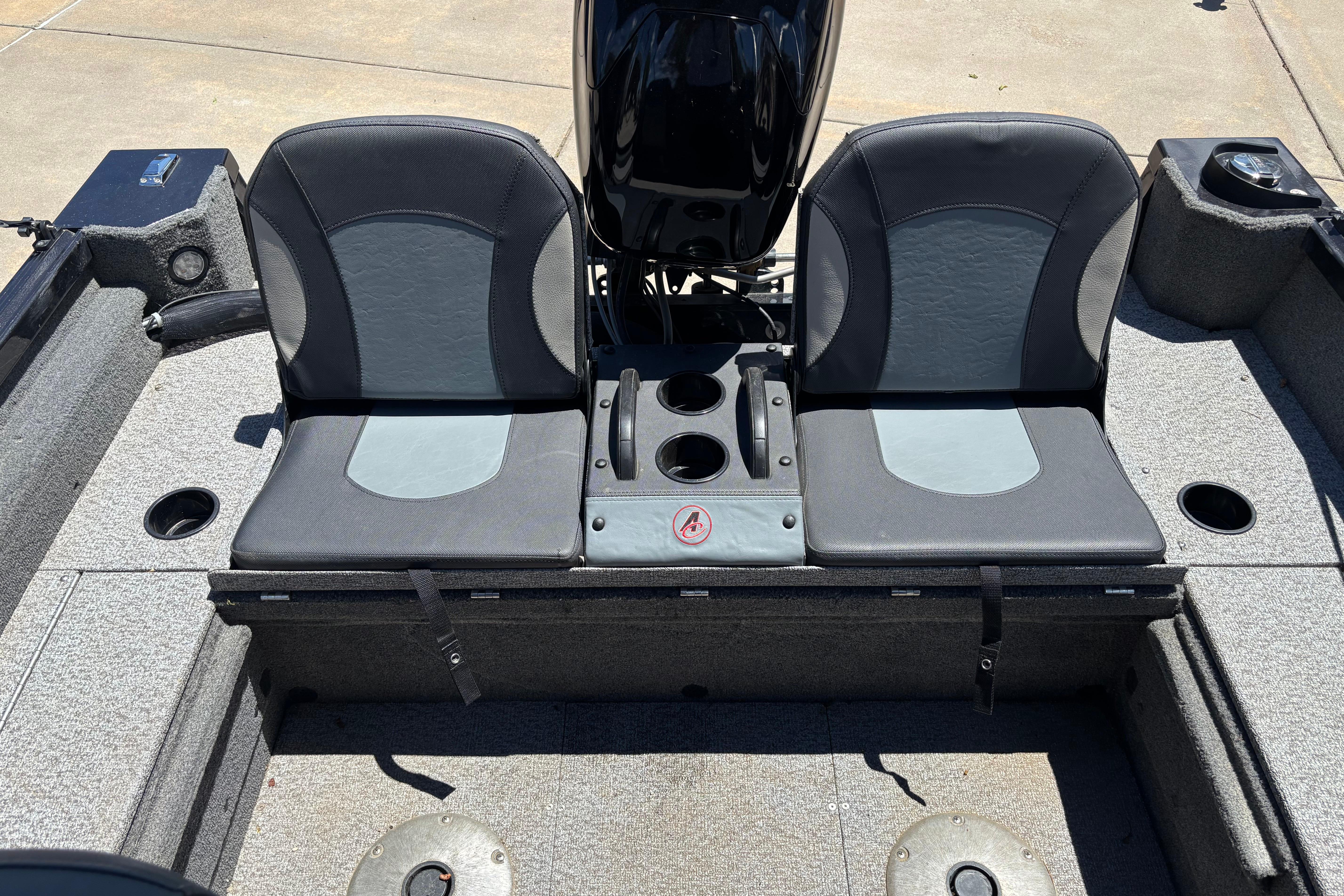 2021 Alumacraft Classic 165 boat seats with cup holders and storage compartments.