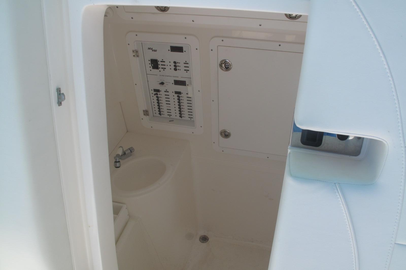 2024 SeaVee 370z boat interior with control panel and sink.