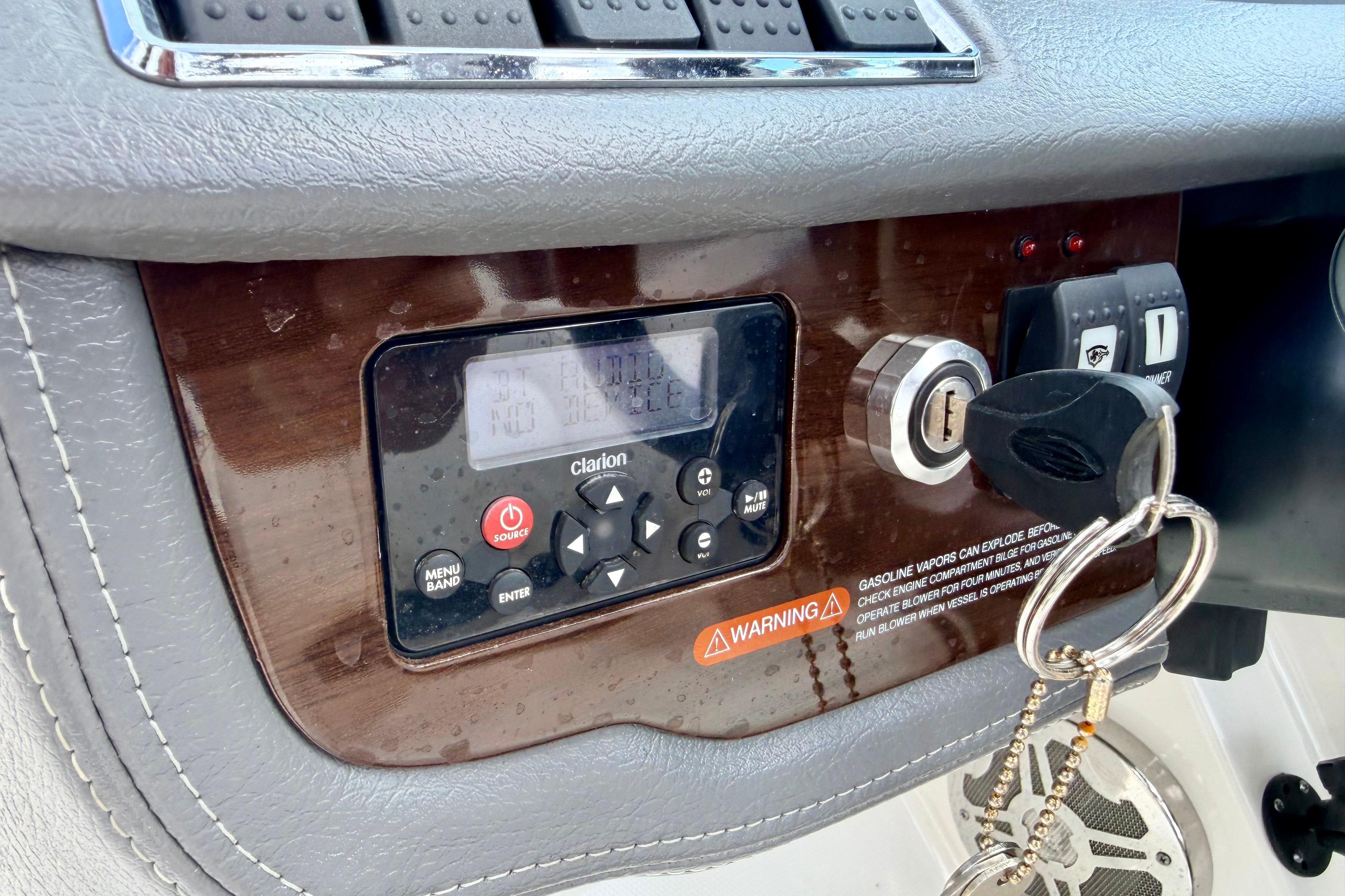 Control panel of a 2015 Chaparral Sunesta 264 boat with ignition and stereo system.