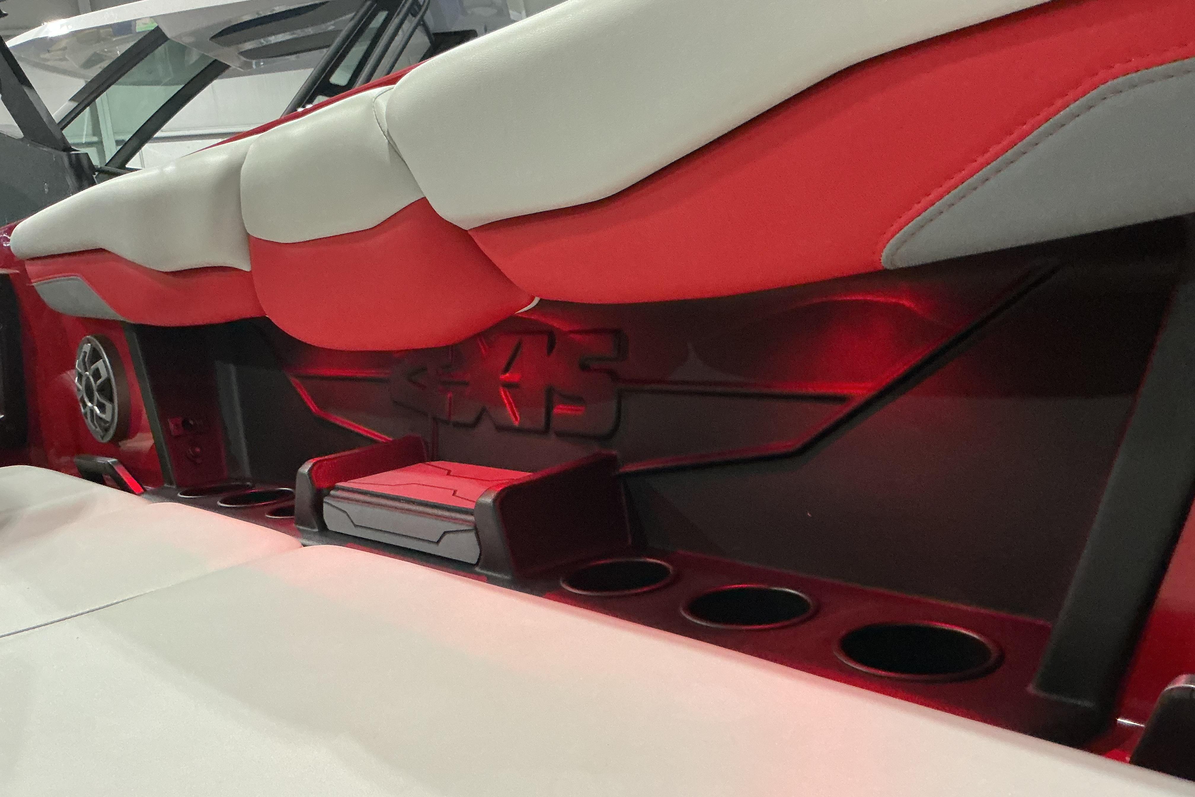2022 Axis T250 boat interior with red and white seating, cup holders, and speaker.