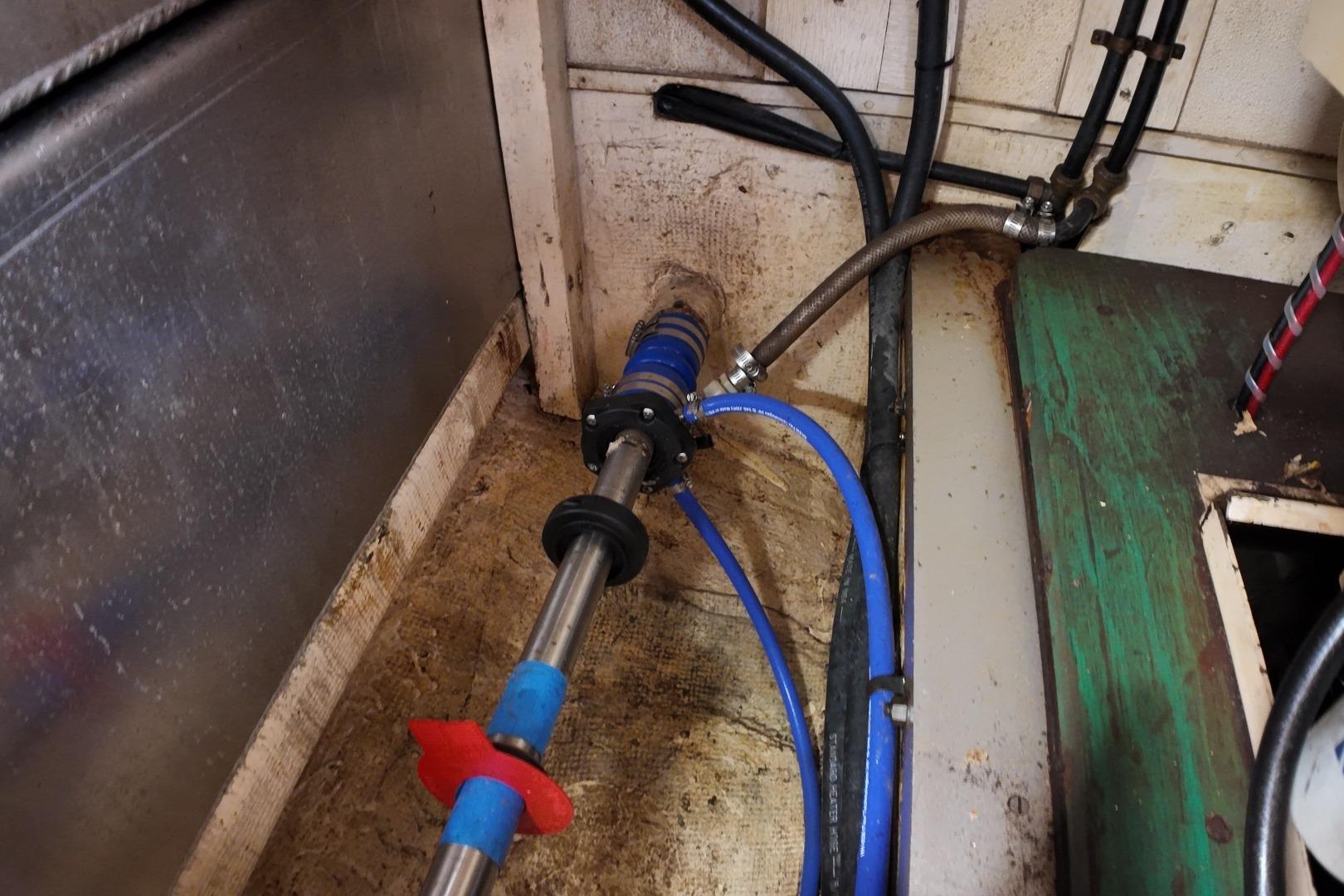 Engine room of a 1978 Grand Banks 42 Classic boat, showing mechanical components and piping.