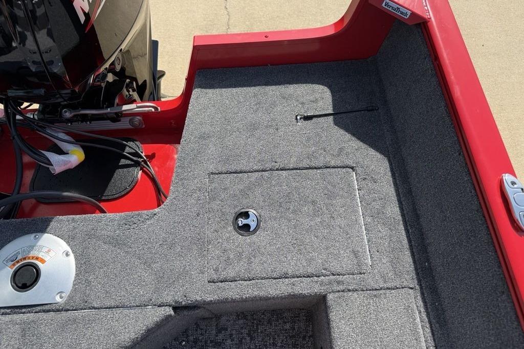 2026 Tracker Pro Guide V-16 SC boat interior with red trim and carpeted flooring.
