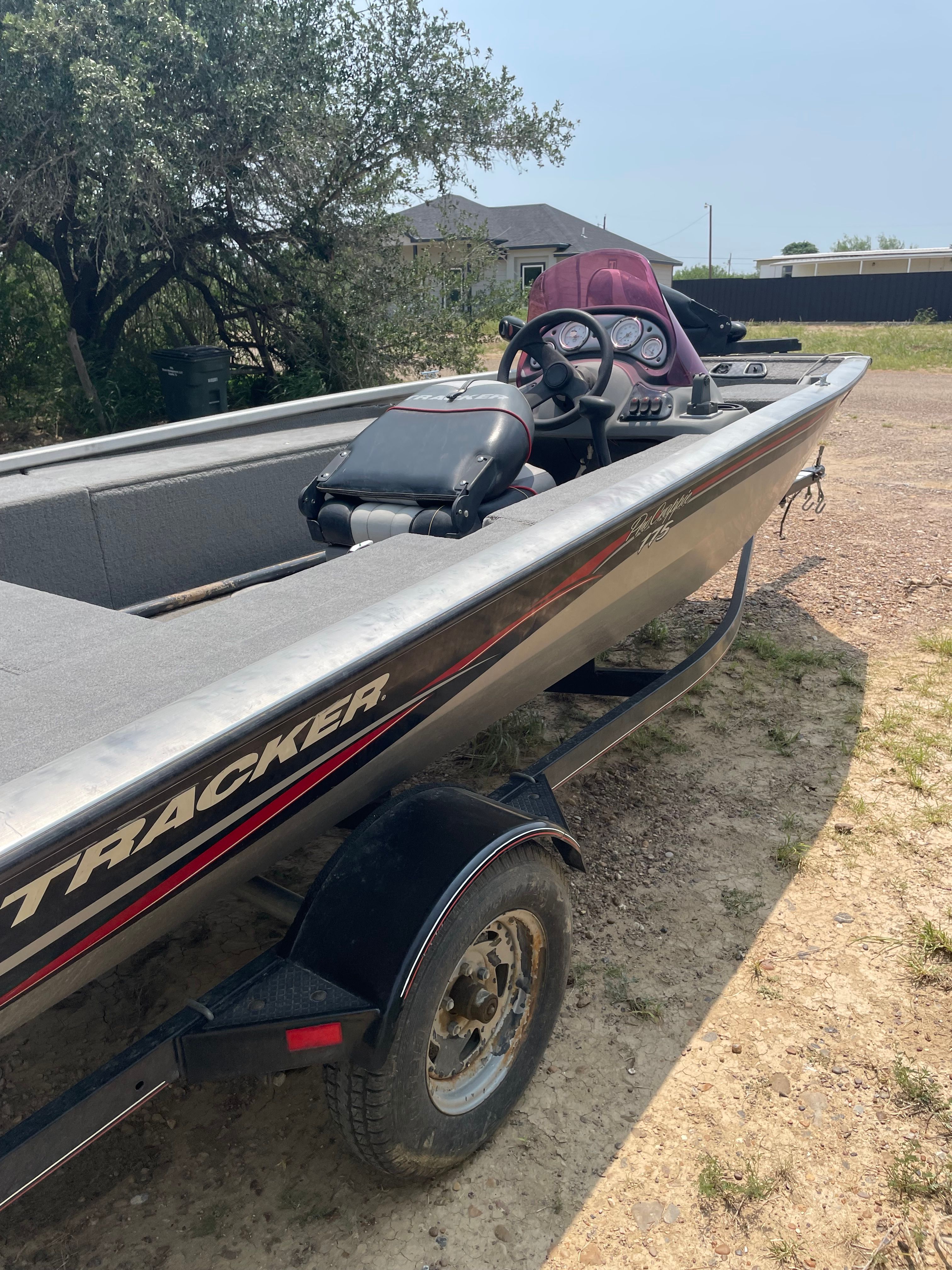 A 2009 Tracker Pro Crappie 175 boat on a trailer on dry land.