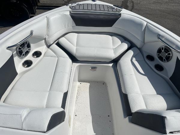 Luxurious 2018 Bryant Speranza boat interior with white seating and built-in speakers.