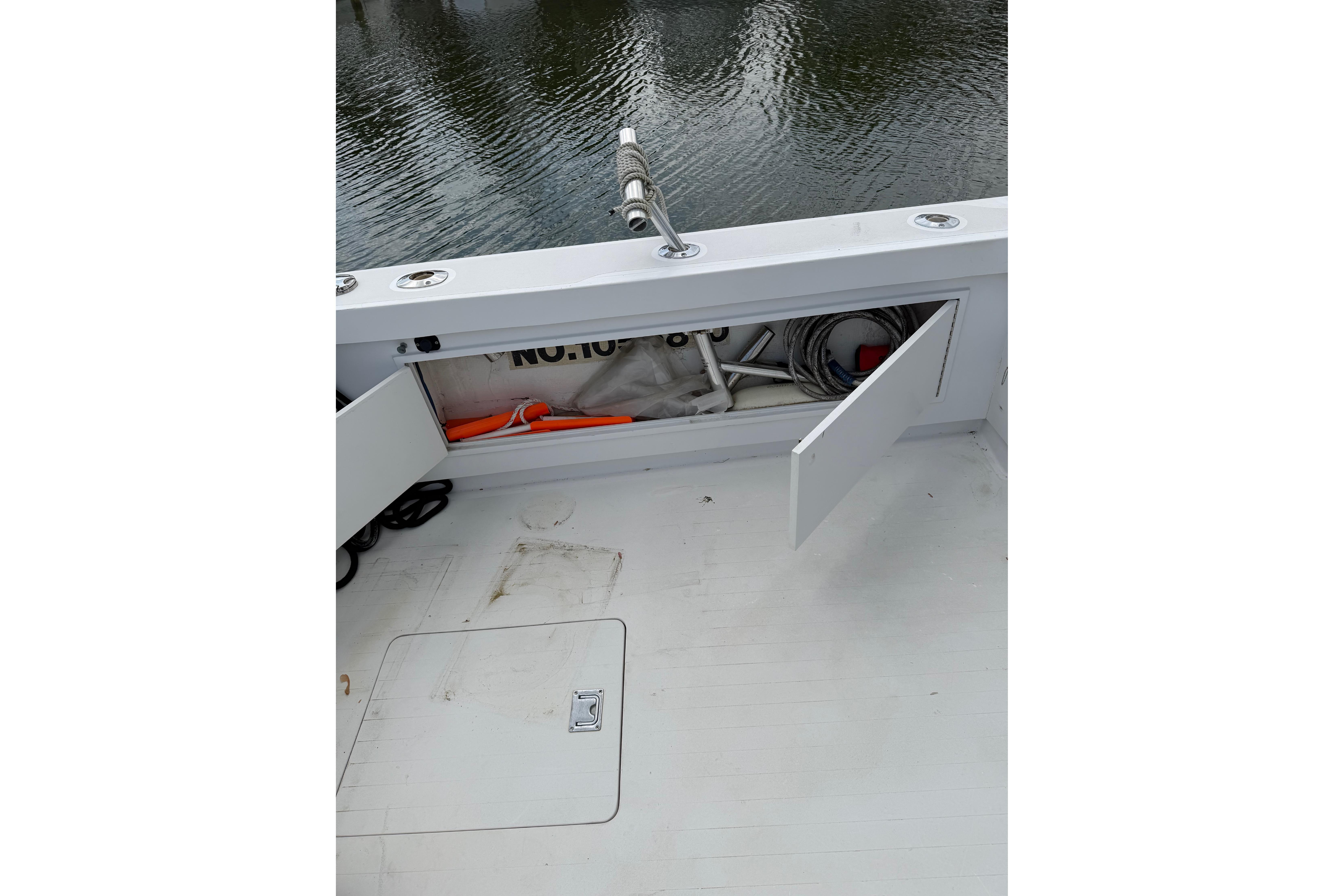 1974 Bertram 35 Convertible boat deck with open storage compartment.