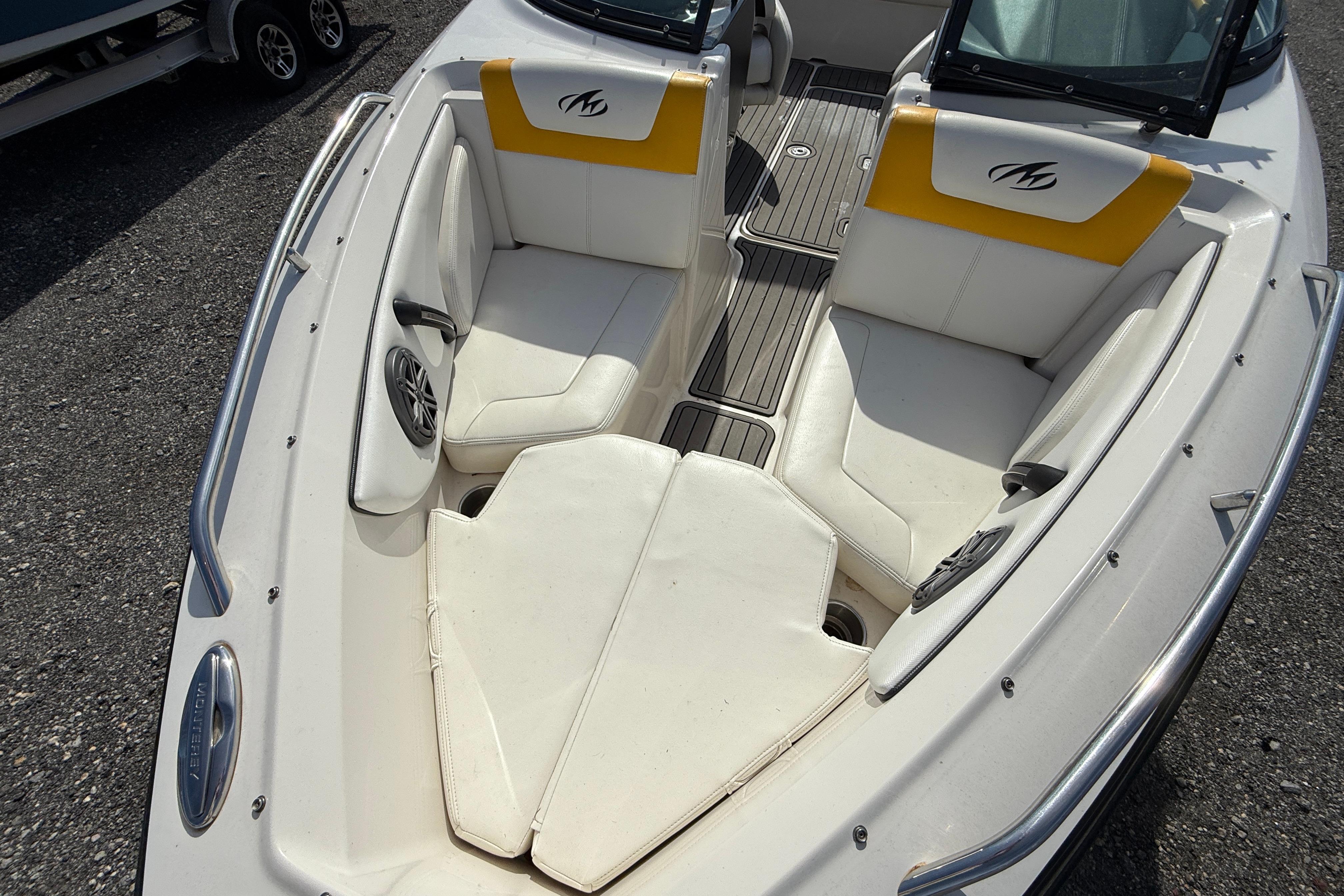 2014 Monterey 197 Blackfin boat interior with white and yellow seating.