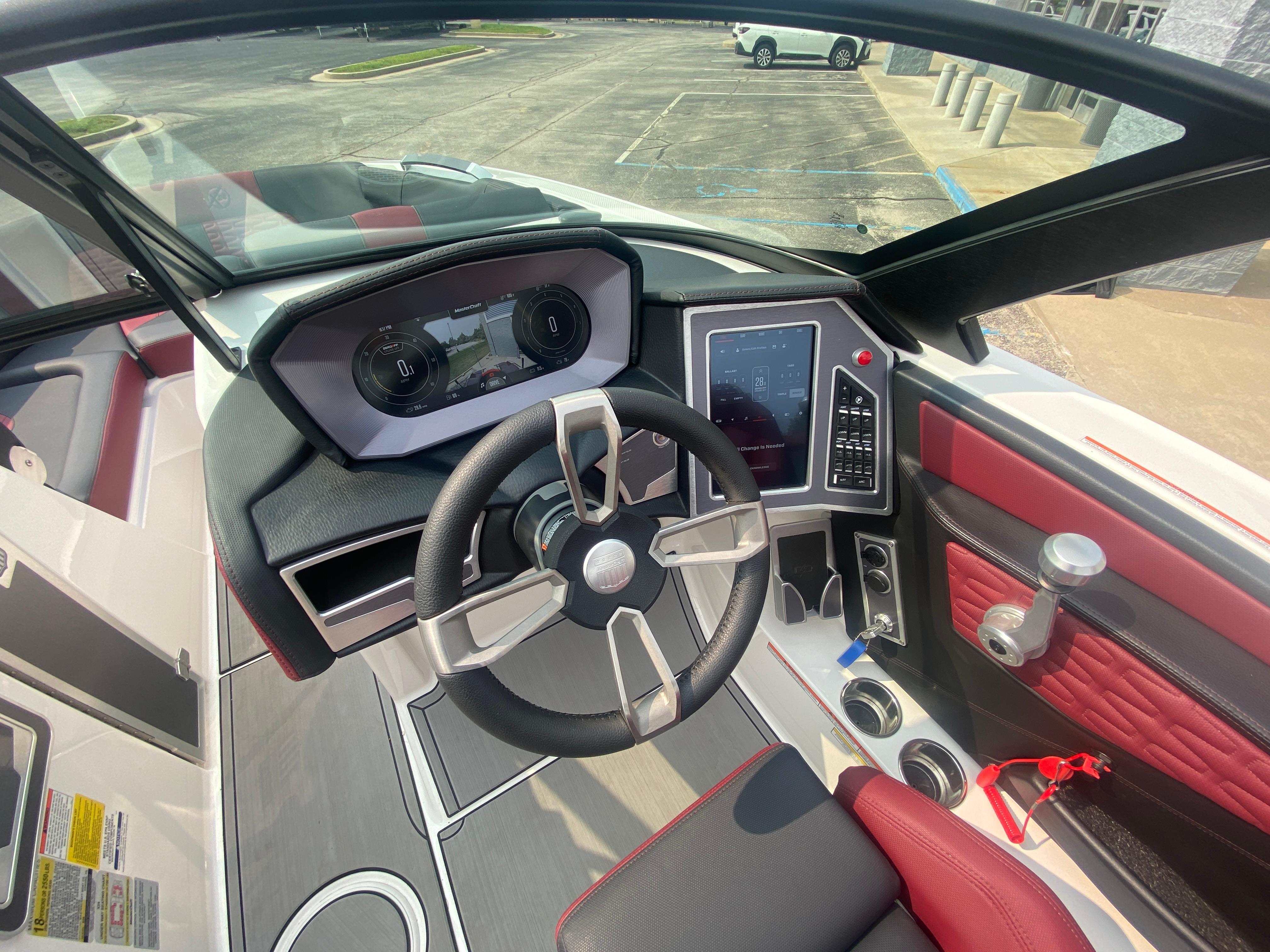2022 MasterCraft X24 boat dashboard with modern controls and steering wheel.