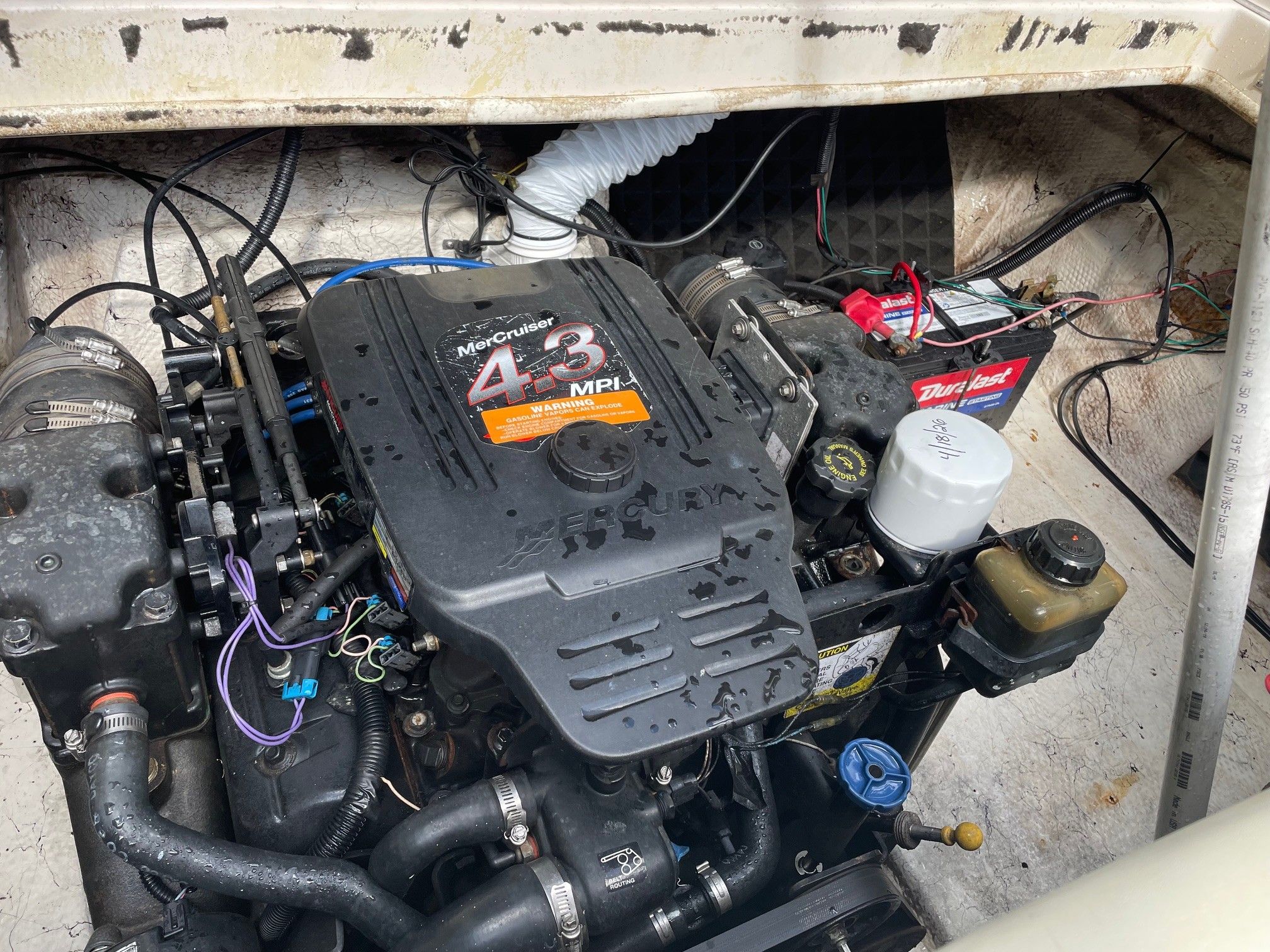 Engine compartment of a 2002 Rinker 212 Captiva Bowrider with MerCruiser 4.3 MPI engine.