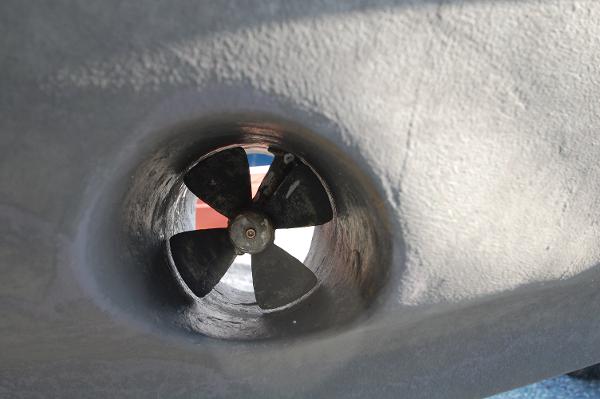 Close-up of a bow thruster on a boat hull.