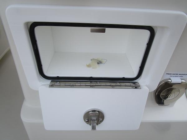 2024 Ranger 2360 Bay boat storage compartment with latch.