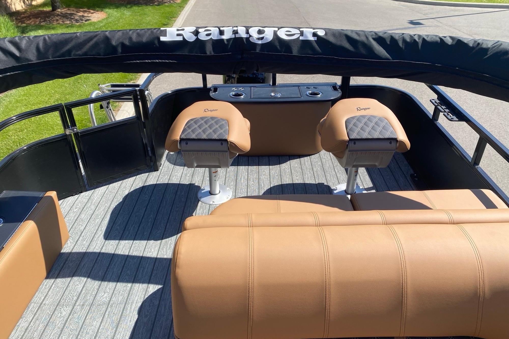 2026 Ranger 223F boat interior with tan seating and black accents.