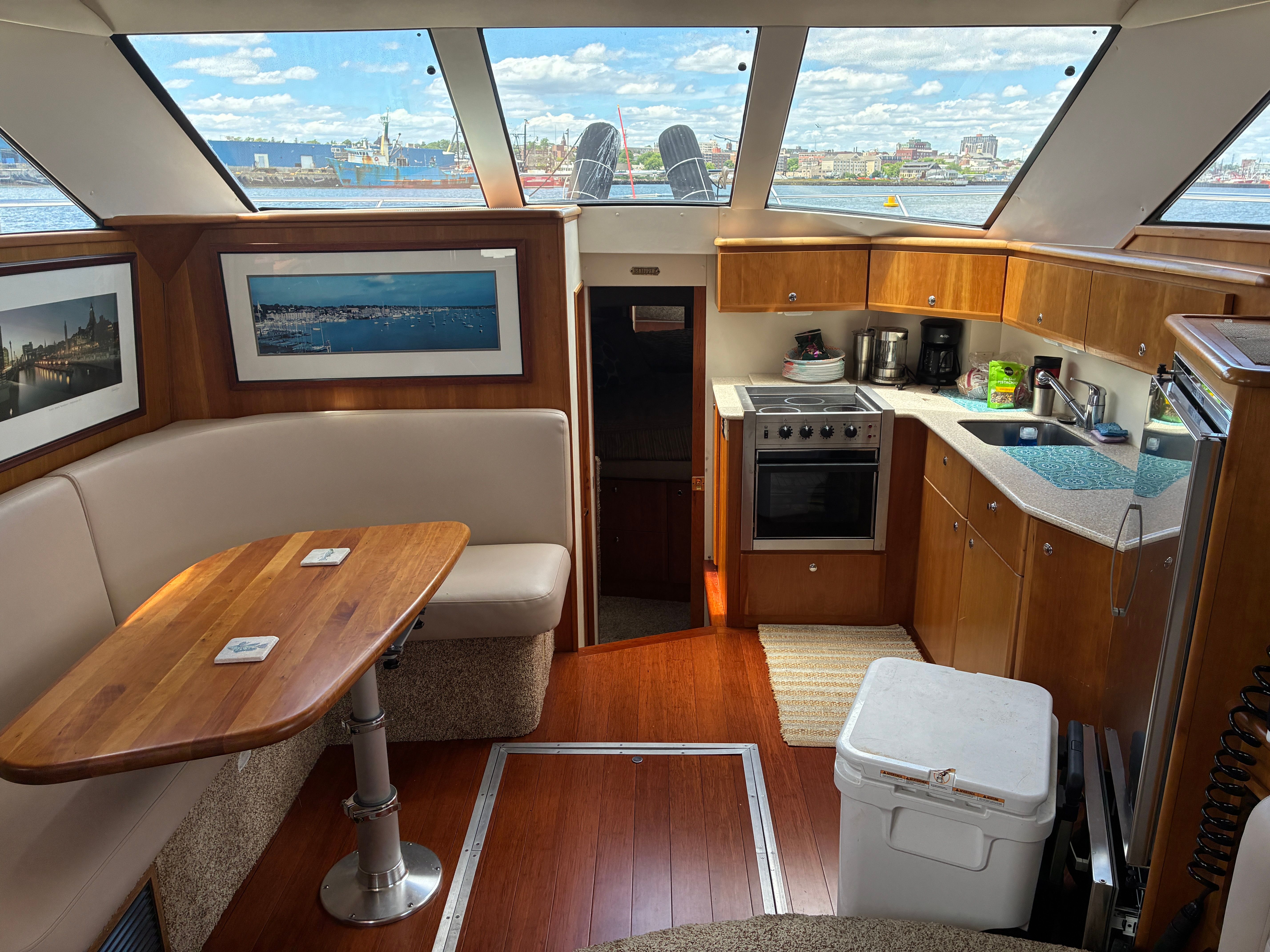 Interior of a 2001 Silverton 392 Motor Yacht with kitchen and seating area.