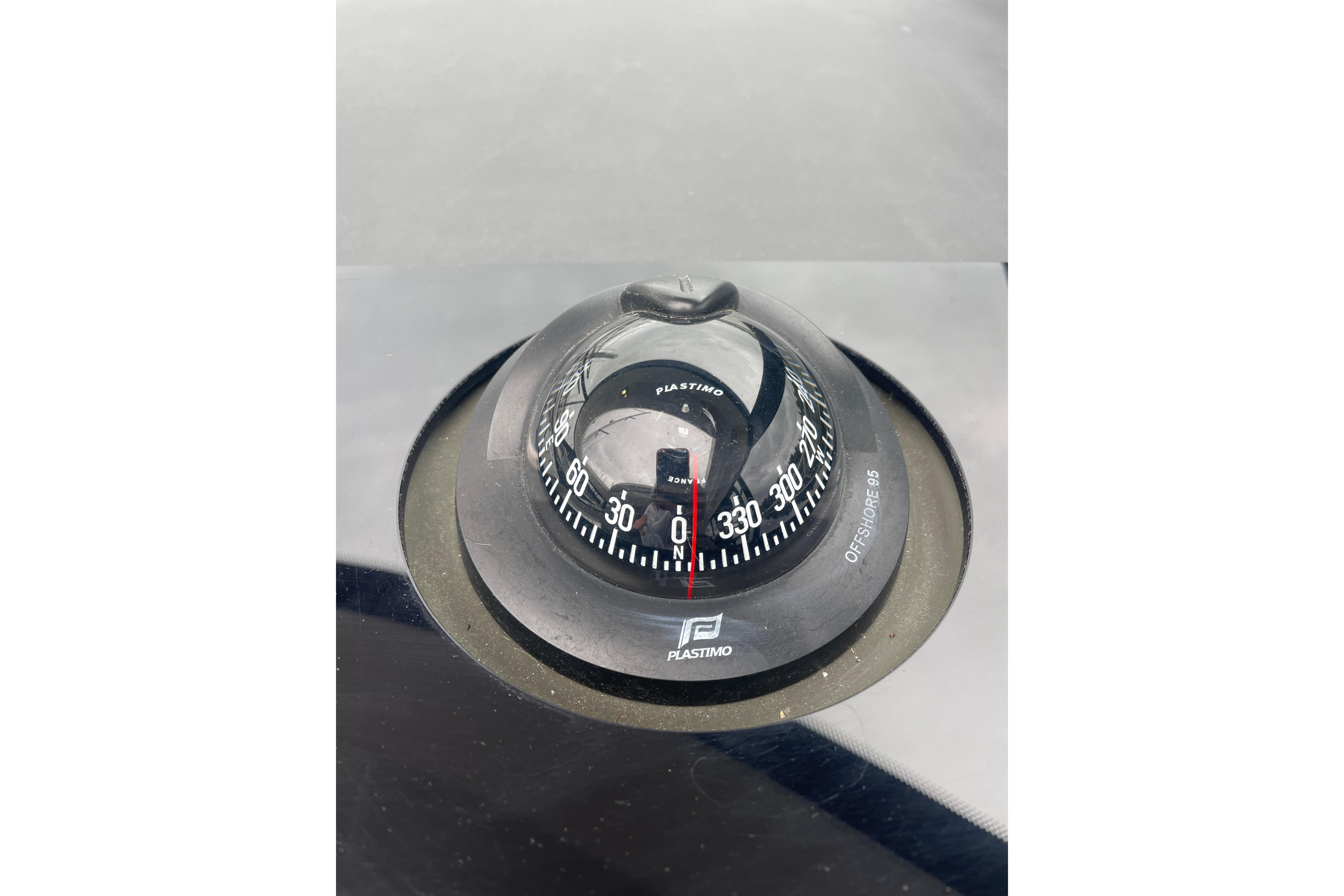 Compass on 2017 Jeanneau Leader 46 yacht dashboard, featuring Plastimo Offshore 95 model.