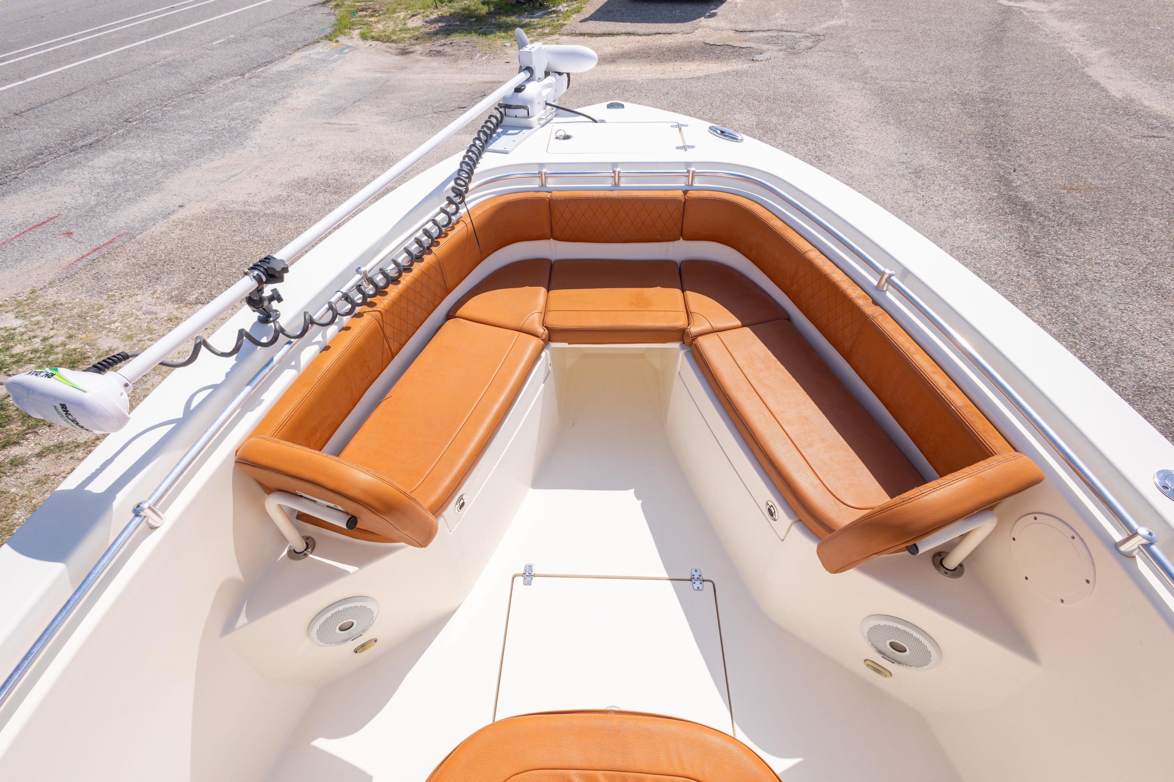 2017 Cobia 261 Center Console boat with tan seating and spacious deck.