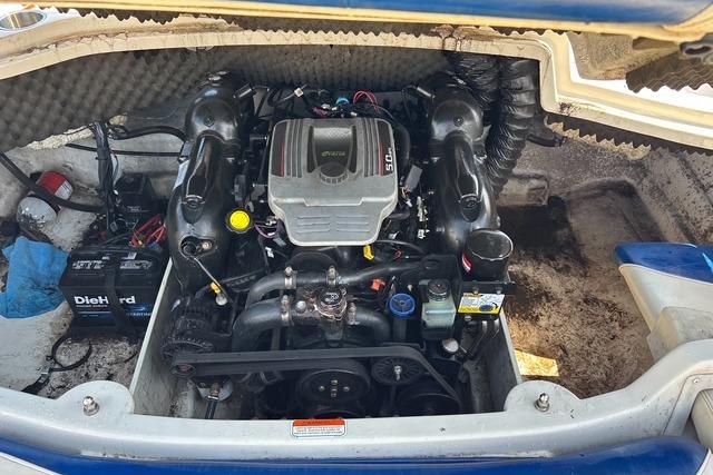 Engine compartment of a 2012 Tahoe Q8 SSi boat, featuring a DieHard battery.