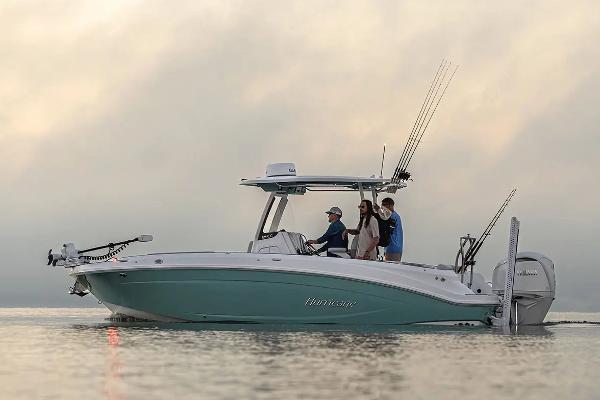 Manufacturer Provided Image: 2026 Hurricane Center Console 24 OB boat on calm water at sunset.
