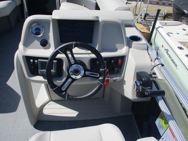 2025 Starcraft LX16R boat dashboard with steering wheel and control panel.
