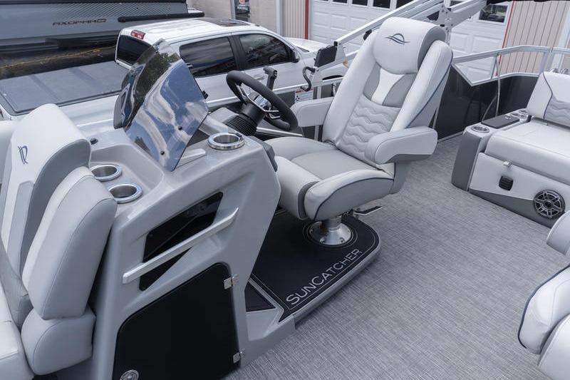 Luxurious interior of 2026 SunCatcher Elite 326 SL pontoon boat with plush seating.
