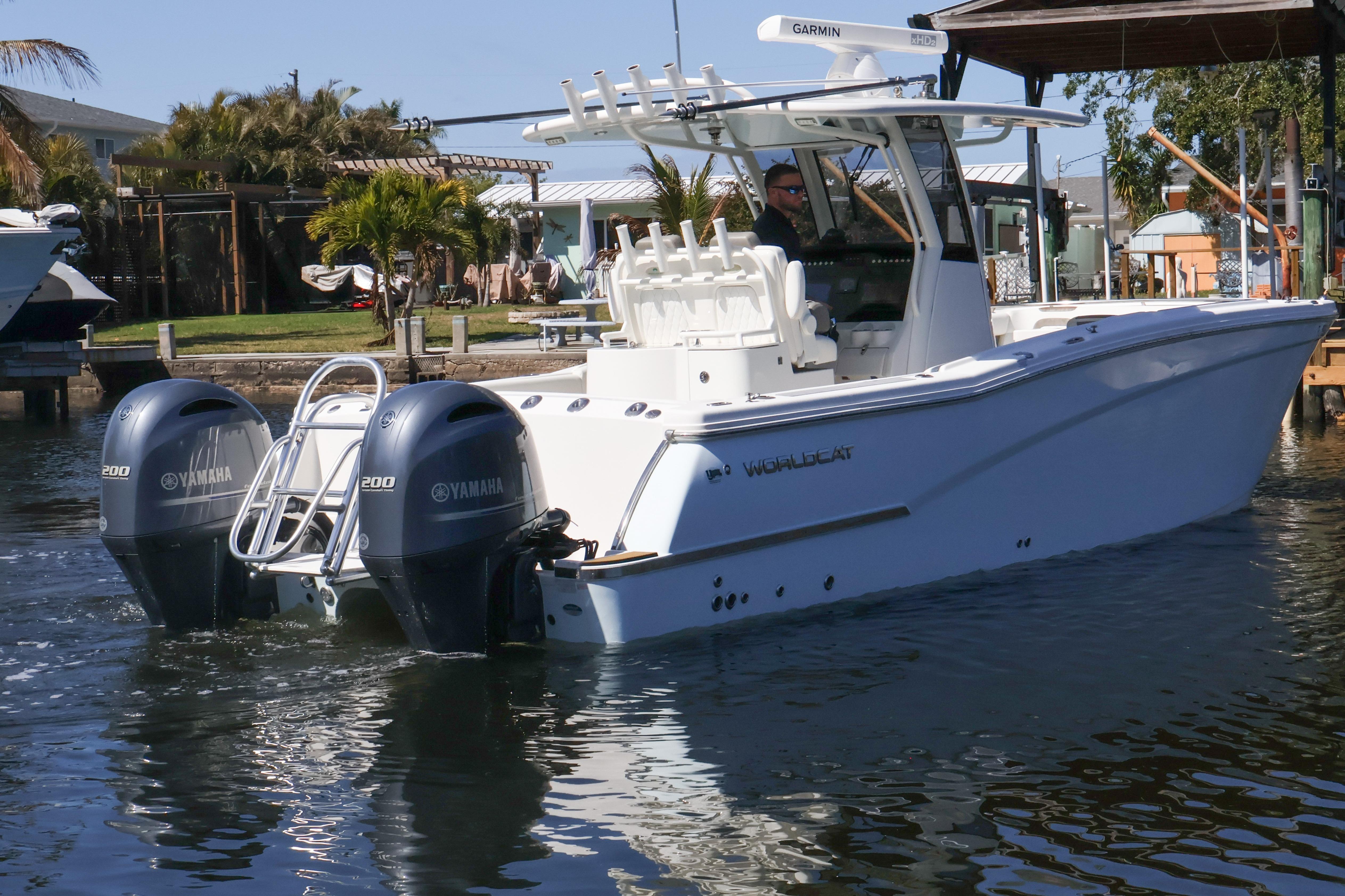 2022 World Cat 280 CC-X boat with twin Yamaha engines on the water.
