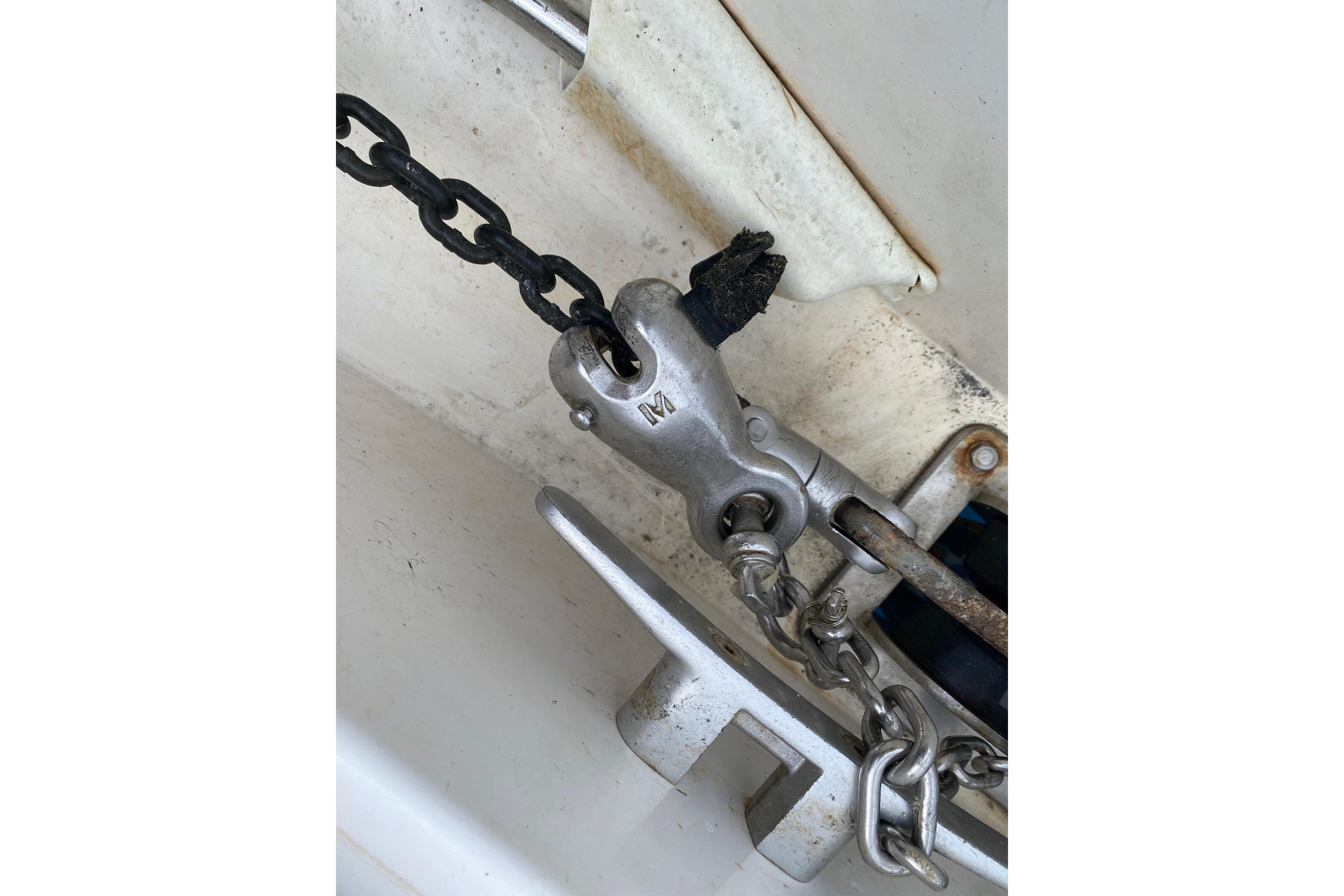 Anchor chain mechanism on a 2017 Leopard 40 boat, featuring metal components and secure connections.