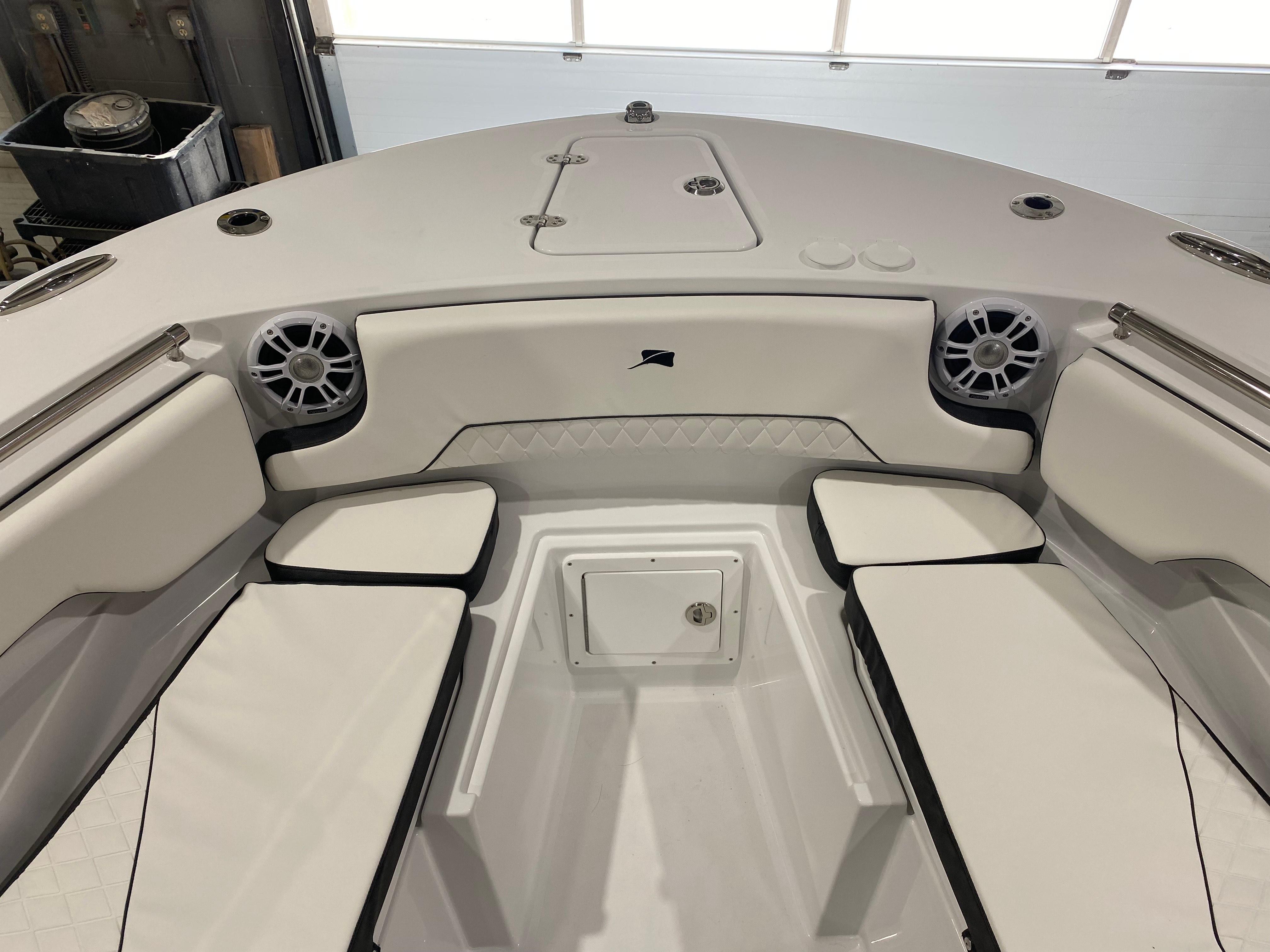 2025 Stingray 253CC boat interior with cushioned seating and speakers.