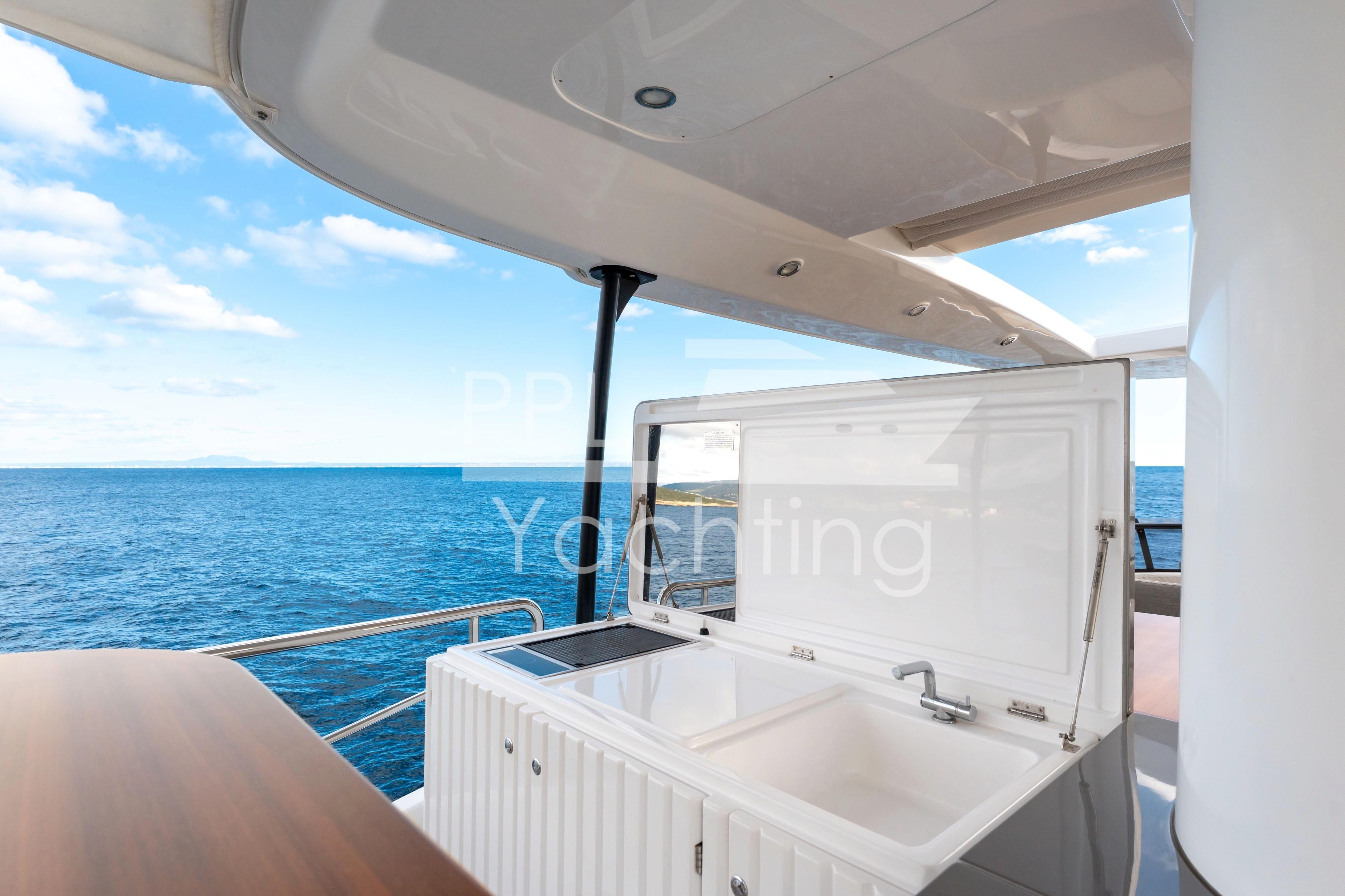 Azimut Magellano 66 yacht deck with sink, overlooking the ocean, 2021 model.