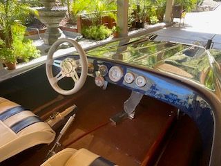 Interior view of a 1980 Sanger HYDRO V DRIVE with steering wheel and dashboard.
