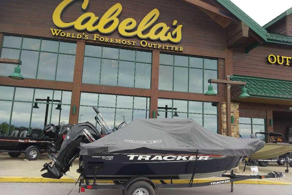 2026 Tracker Pro Guide V-16 WT boat covered outside Cabela's store.