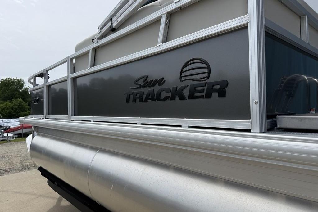 2026 Sun Tracker Bass Buggy 16 XL Select pontoon boat, side view with logo.
