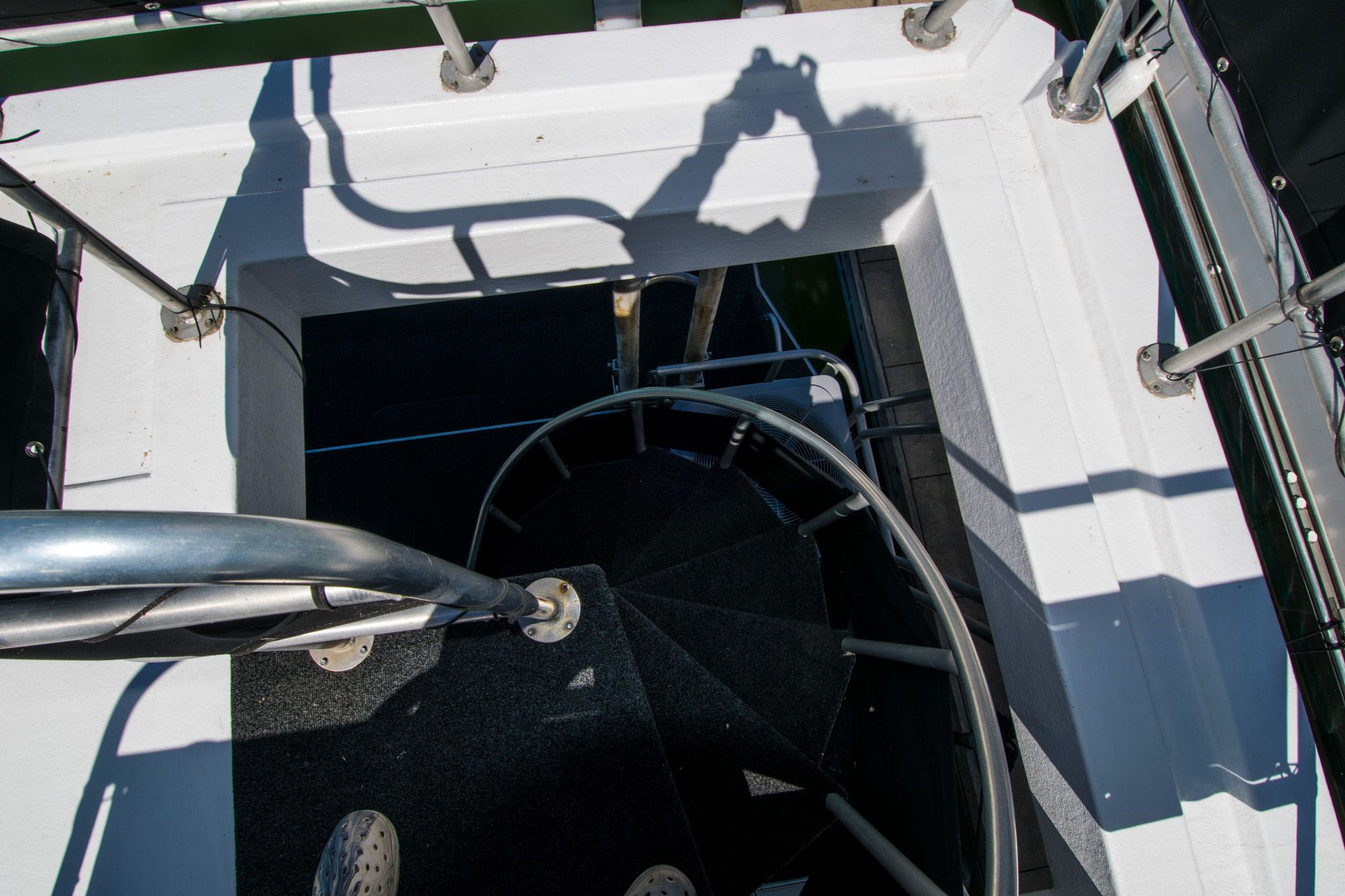 Spiral staircase on 2003 Lakeview 16x70 houseboat.