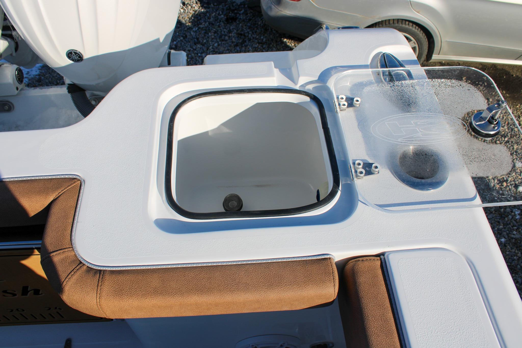 2026 Sea Hunt Gamefish 25 boat interior with livewell and seating area.
