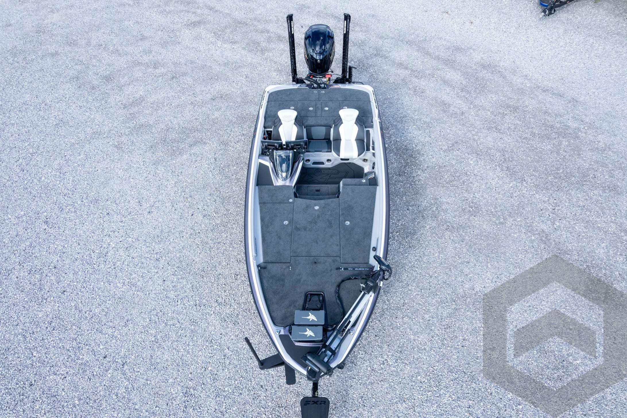 2026 Skeeter FXR20 FLEX fishing boat, aerial view on gravel surface.