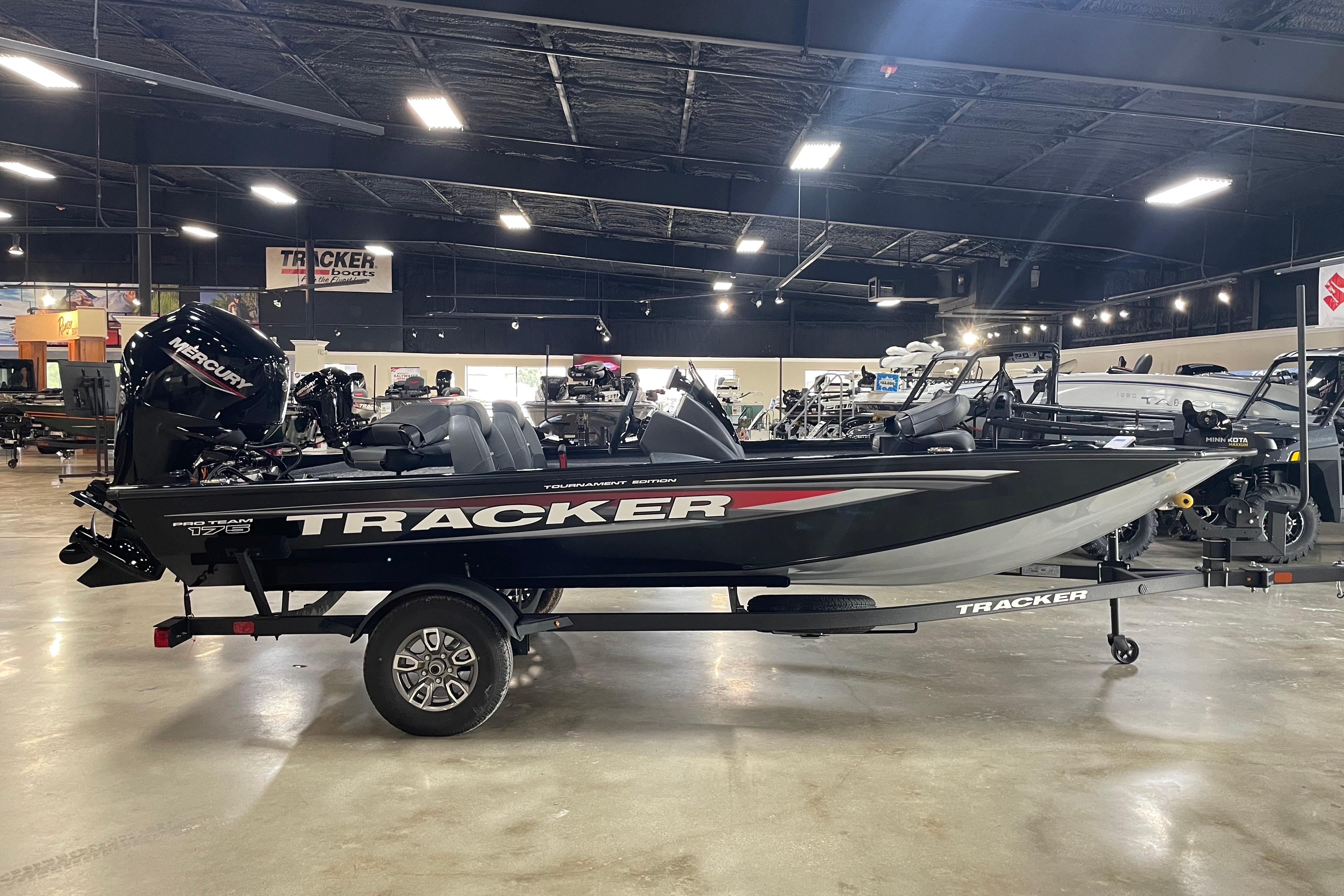 2026 Tracker Pro Team 175 Crappie Edition boat displayed in a showroom.