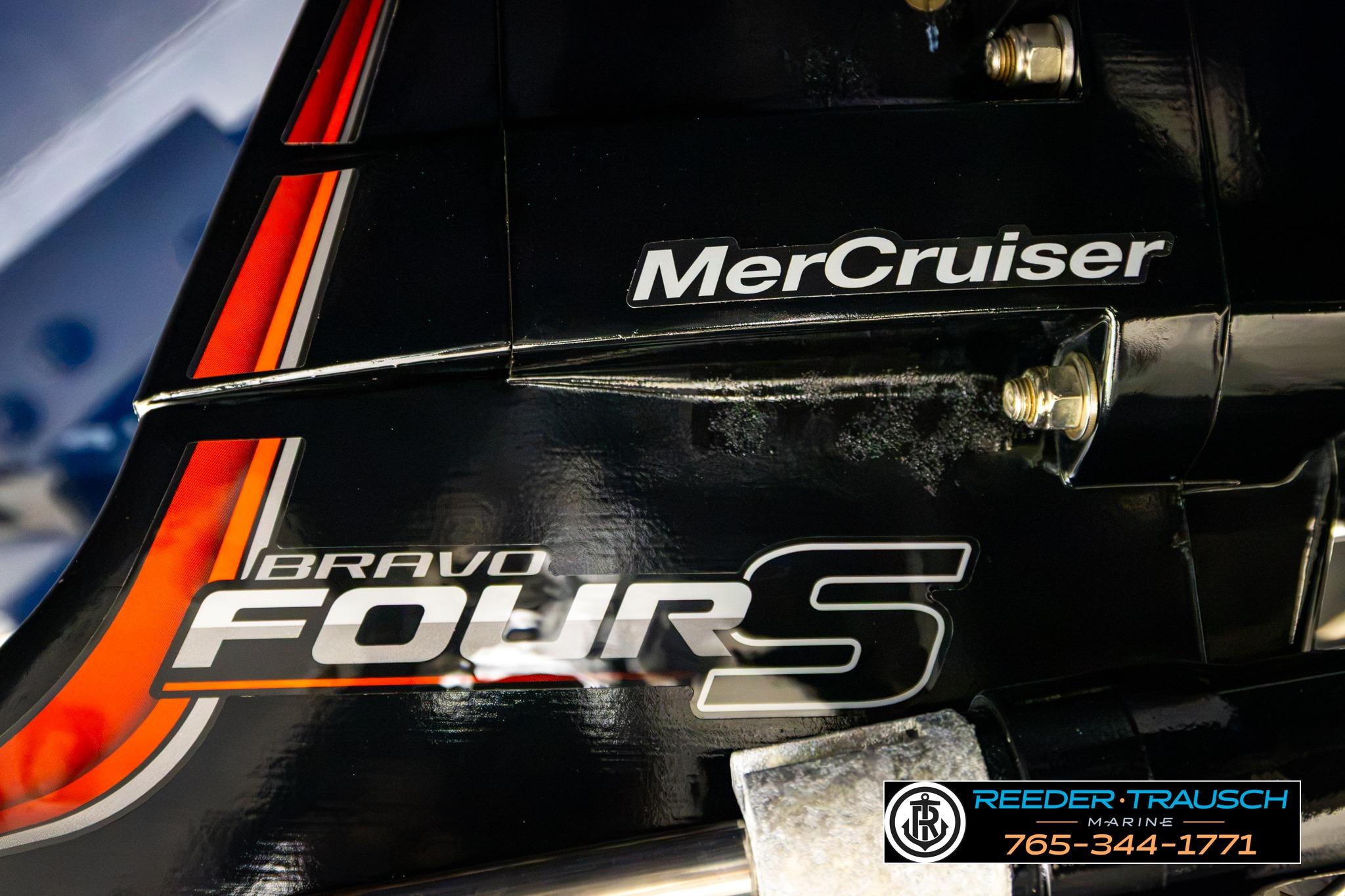 Close-up of 2024 FOURWINNS HD5 Surf boat engine with MerCruiser branding.