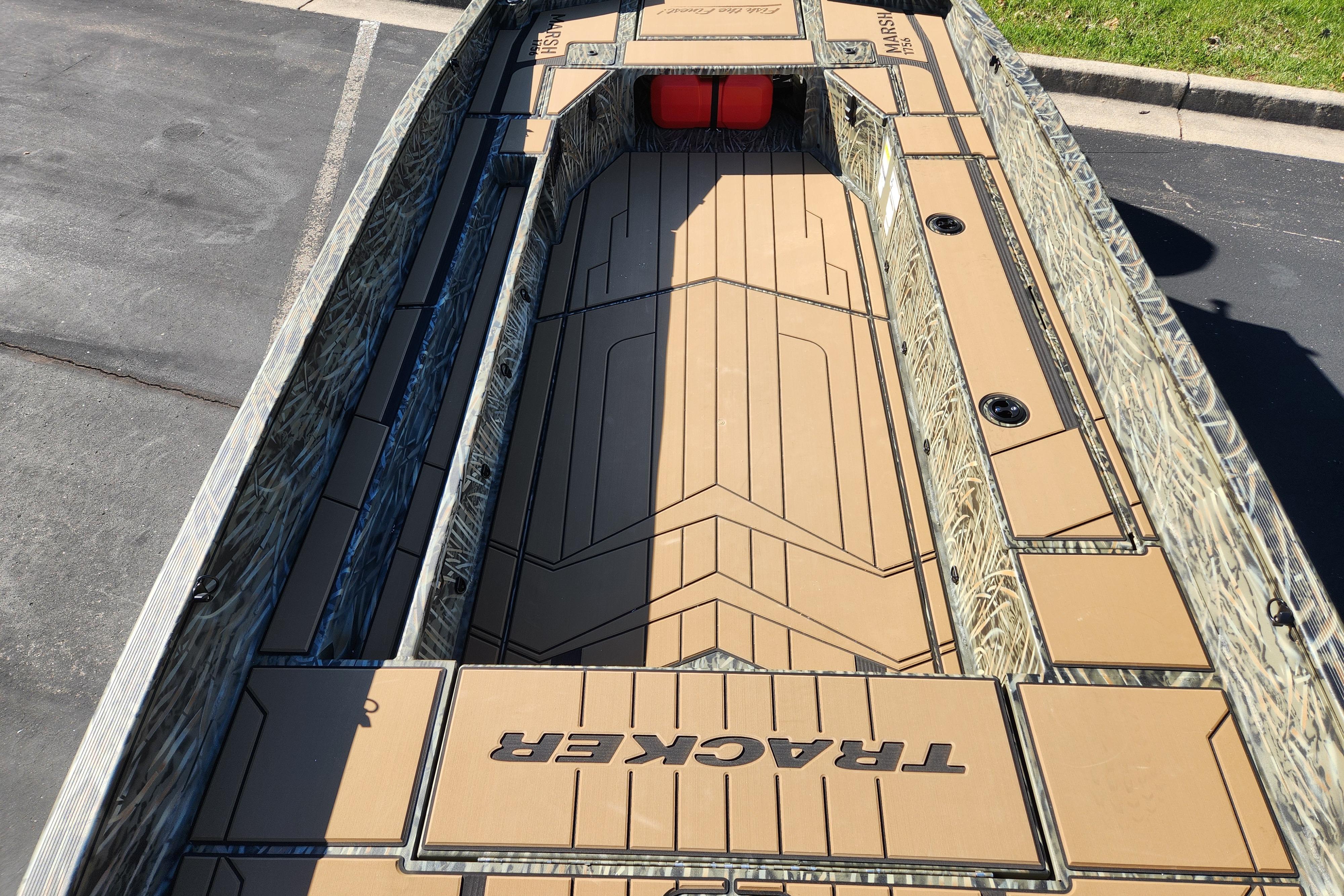 2026 Tracker Grizzly 1756 T Marsh boat interior with camo design and spacious deck layout.
