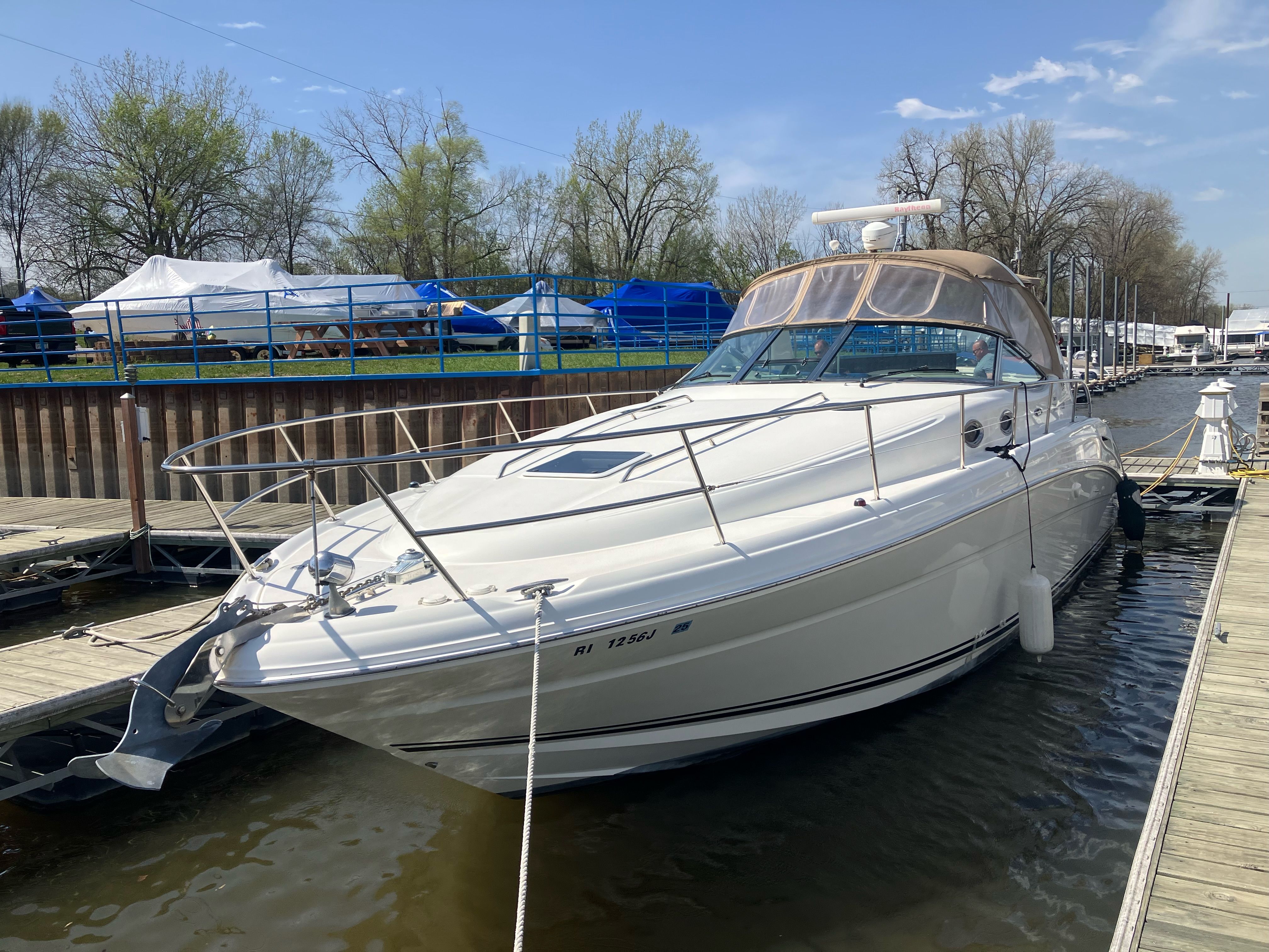 2002 Sea Ray 360 Sundancer docked on a sunny day.