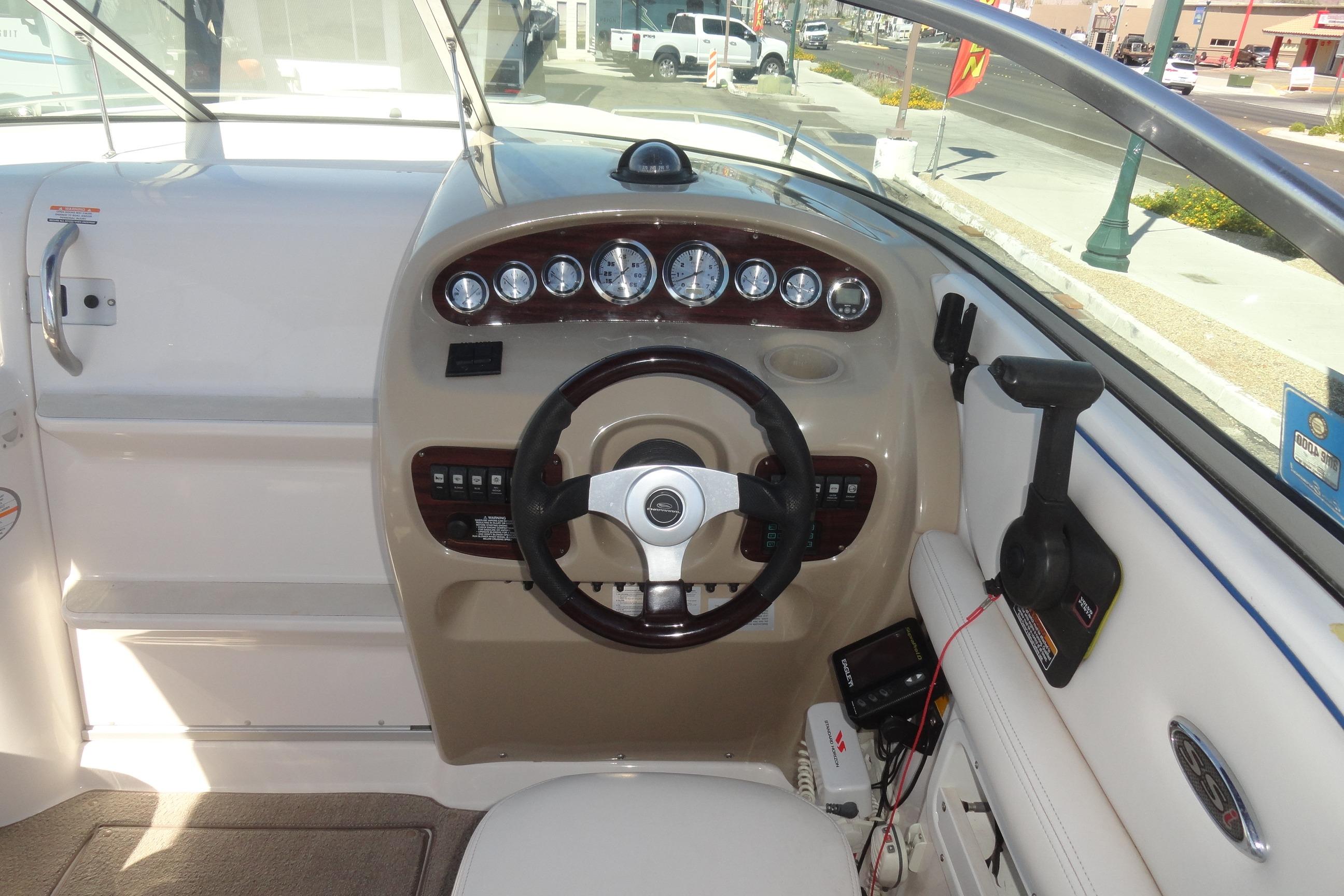 Cockpit of 2001 Chaparral 265 SSi boat with steering wheel and instrument panel.